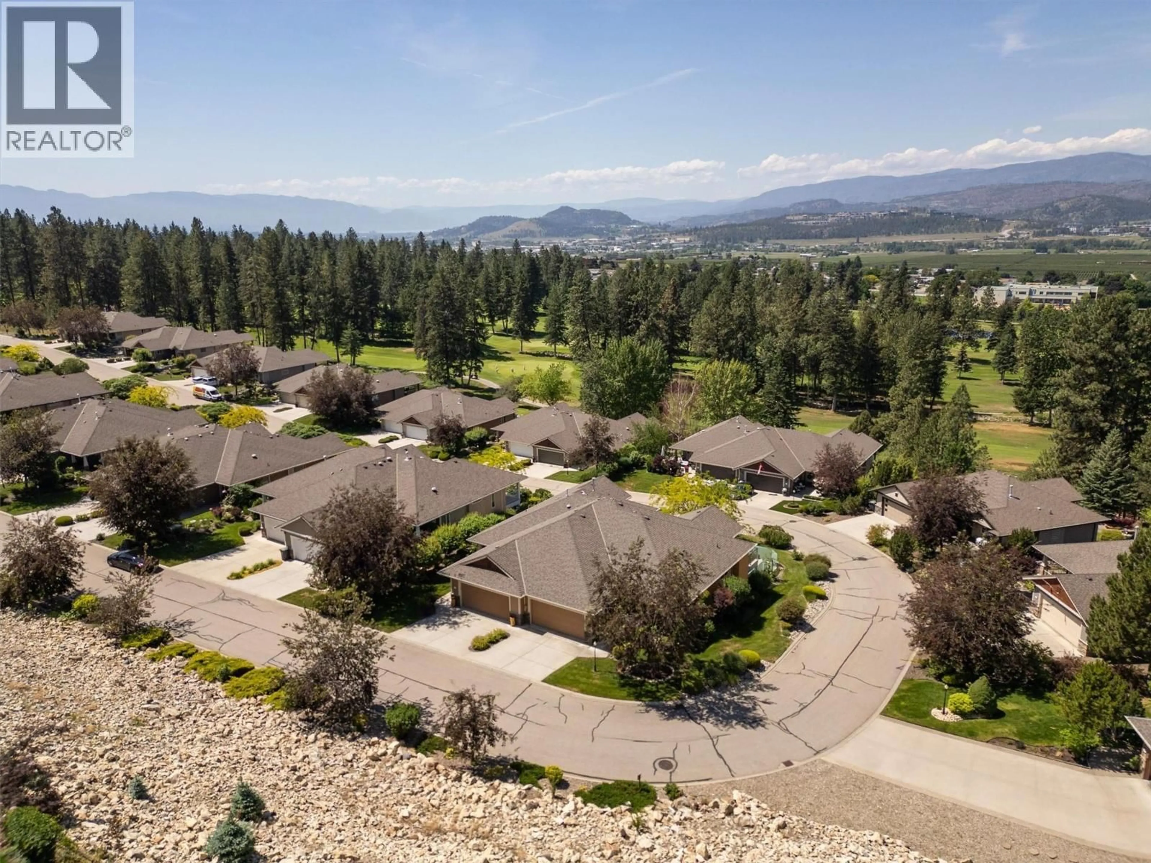 A pic from outside/outdoor area/front of a property/back of a property/a pic from drone, mountain view for 3590 SHADOW CREEK DRIVE, Kelowna British Columbia V1X8A7