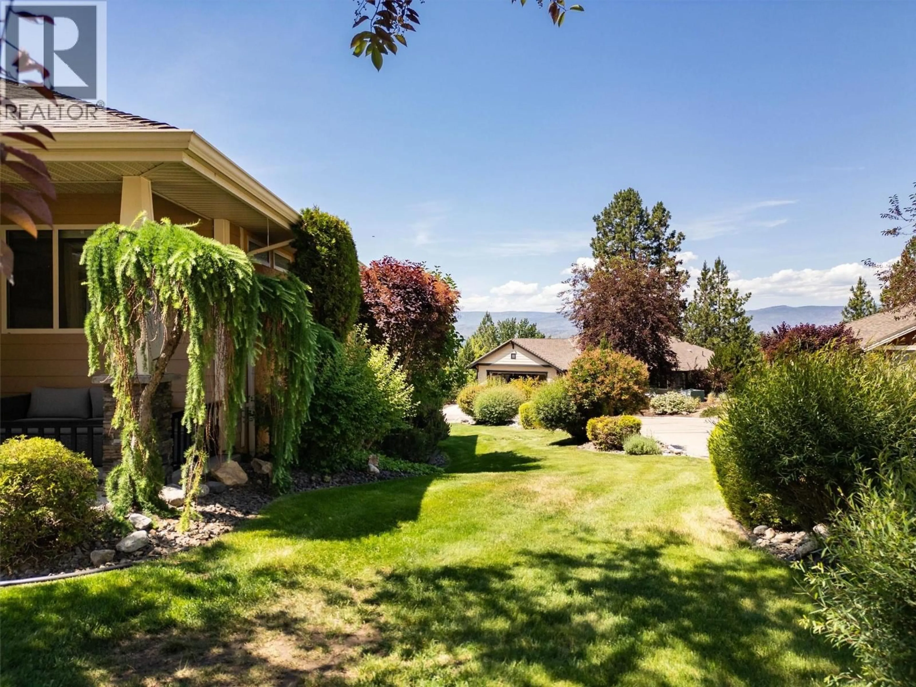 A pic from outside/outdoor area/front of a property/back of a property/a pic from drone, mountain view for 3590 SHADOW CREEK DRIVE, Kelowna British Columbia V1X8A7