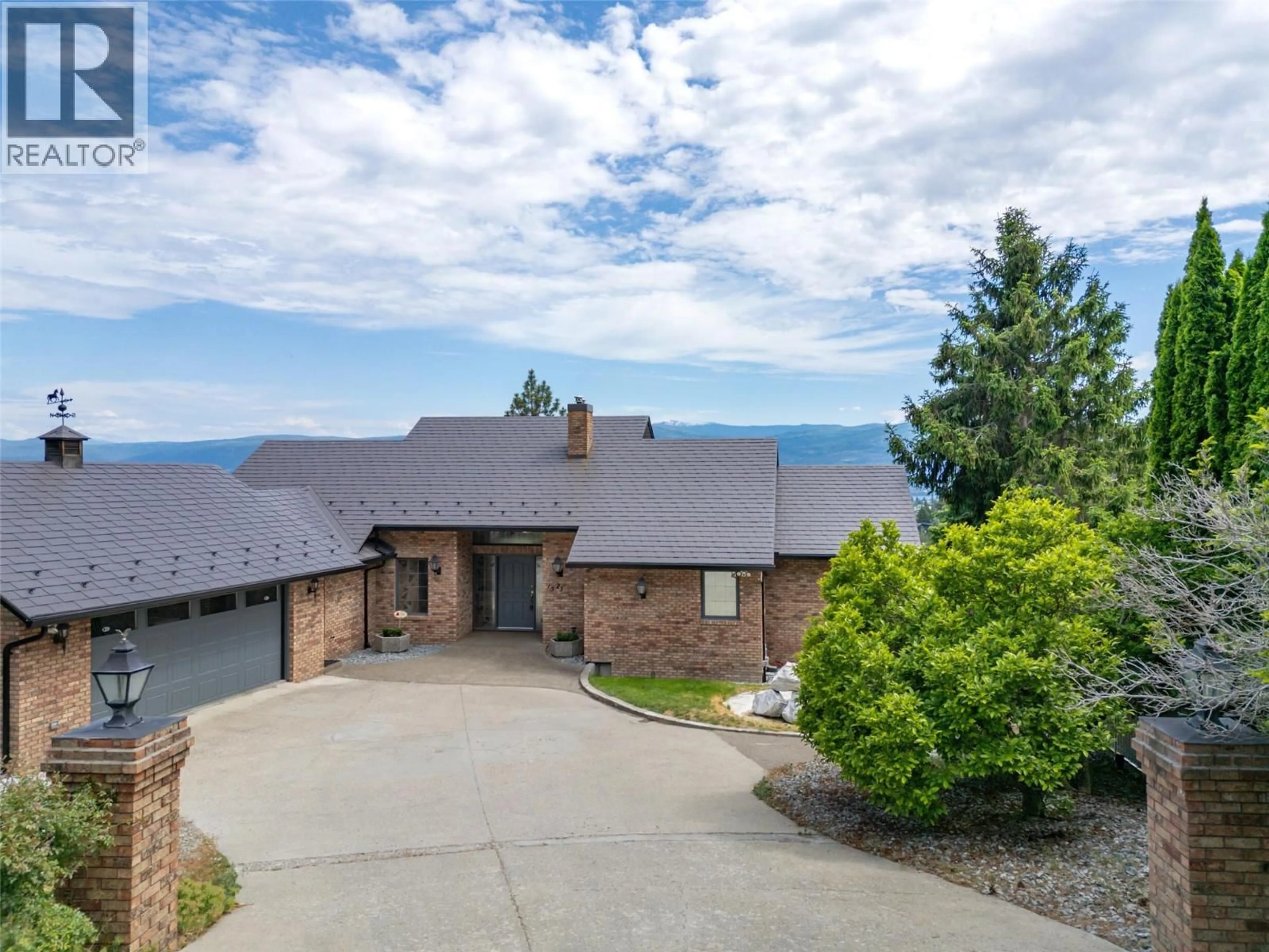 A pic from outside/outdoor area/front of a property/back of a property/a pic from drone, mountain view for 1525 KLEIN ROAD, West Kelowna British Columbia V1Z3H5