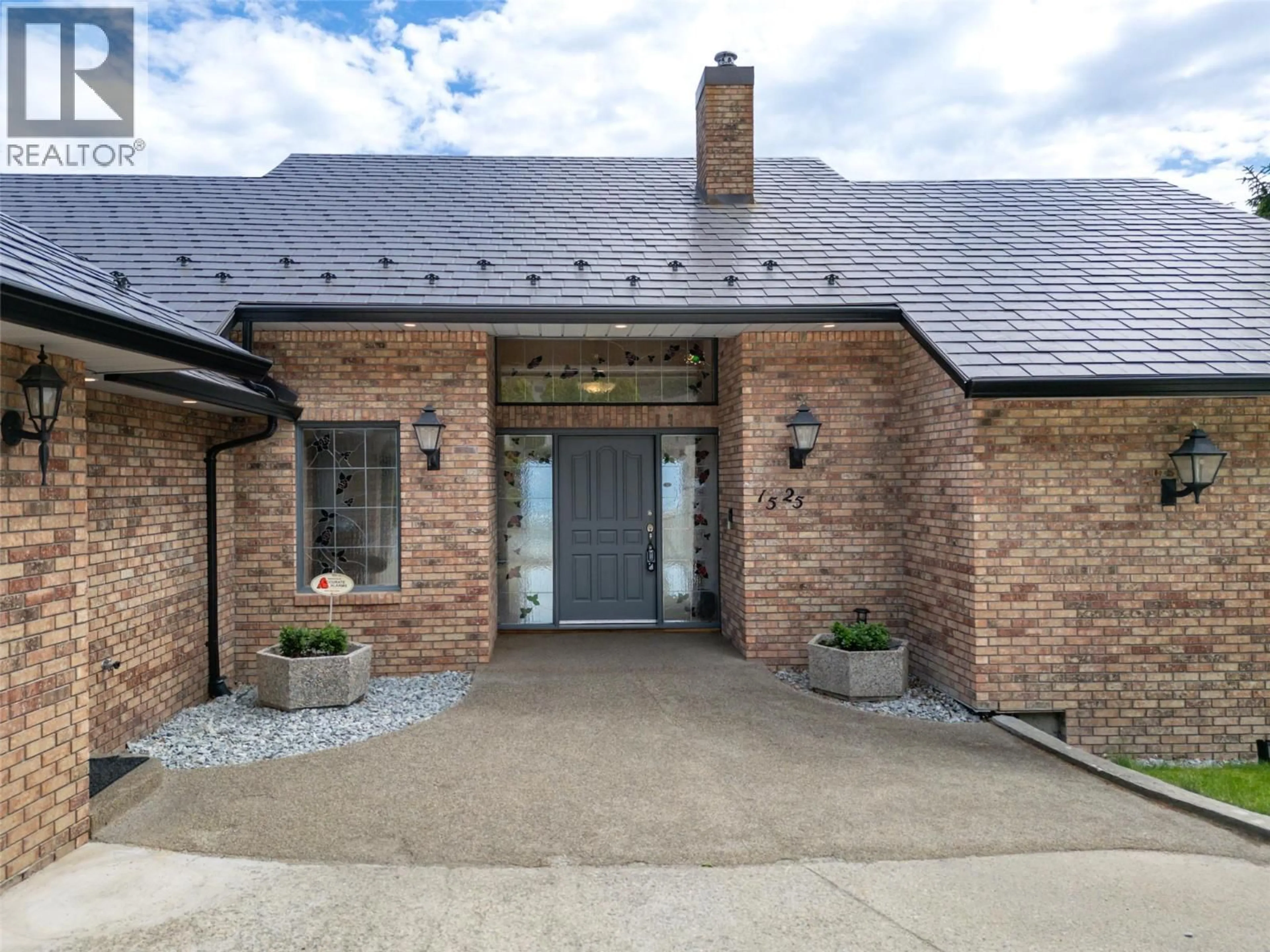 Home with brick exterior material, street for 1525 KLEIN ROAD, West Kelowna British Columbia V1Z3H5