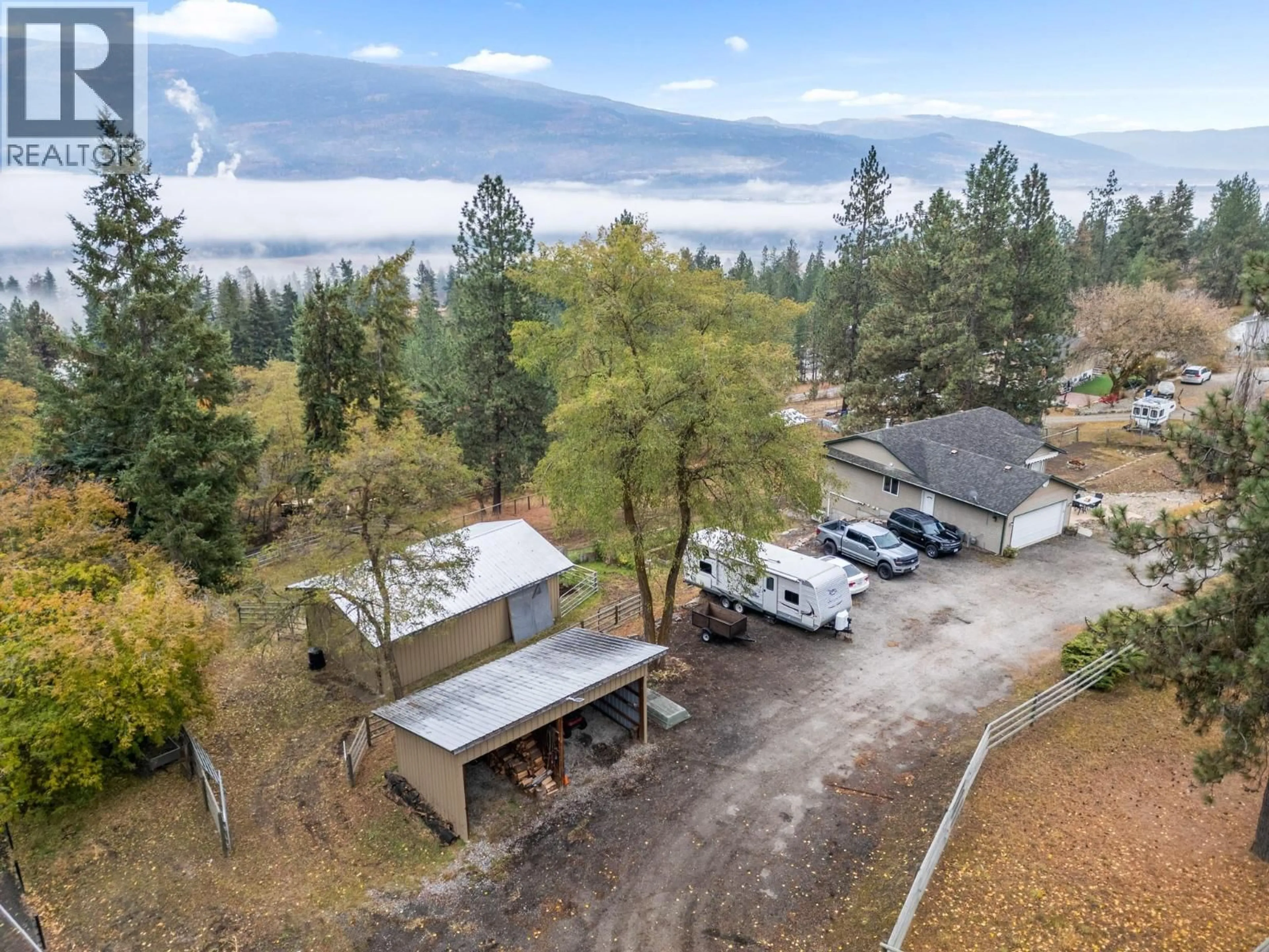 A pic from outside/outdoor area/front of a property/back of a property/a pic from drone, forest/trees view for 4666 GRANDVIEW FLATS ROAD NORTH, Spallumcheen British Columbia V4Y0P7