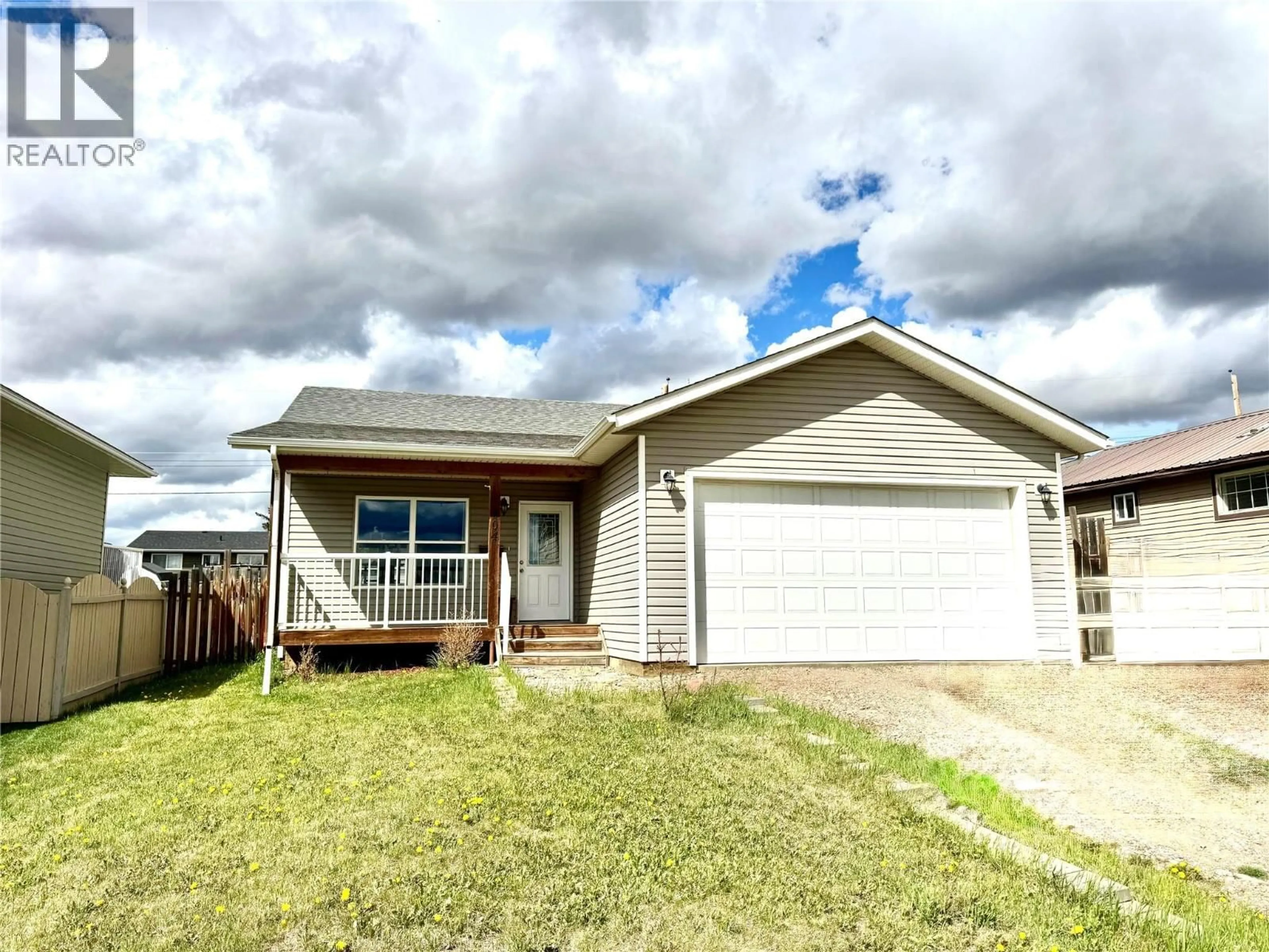 Home with vinyl exterior material, street for 704 99 AVENUE, Dawson Creek British Columbia V1G1T4