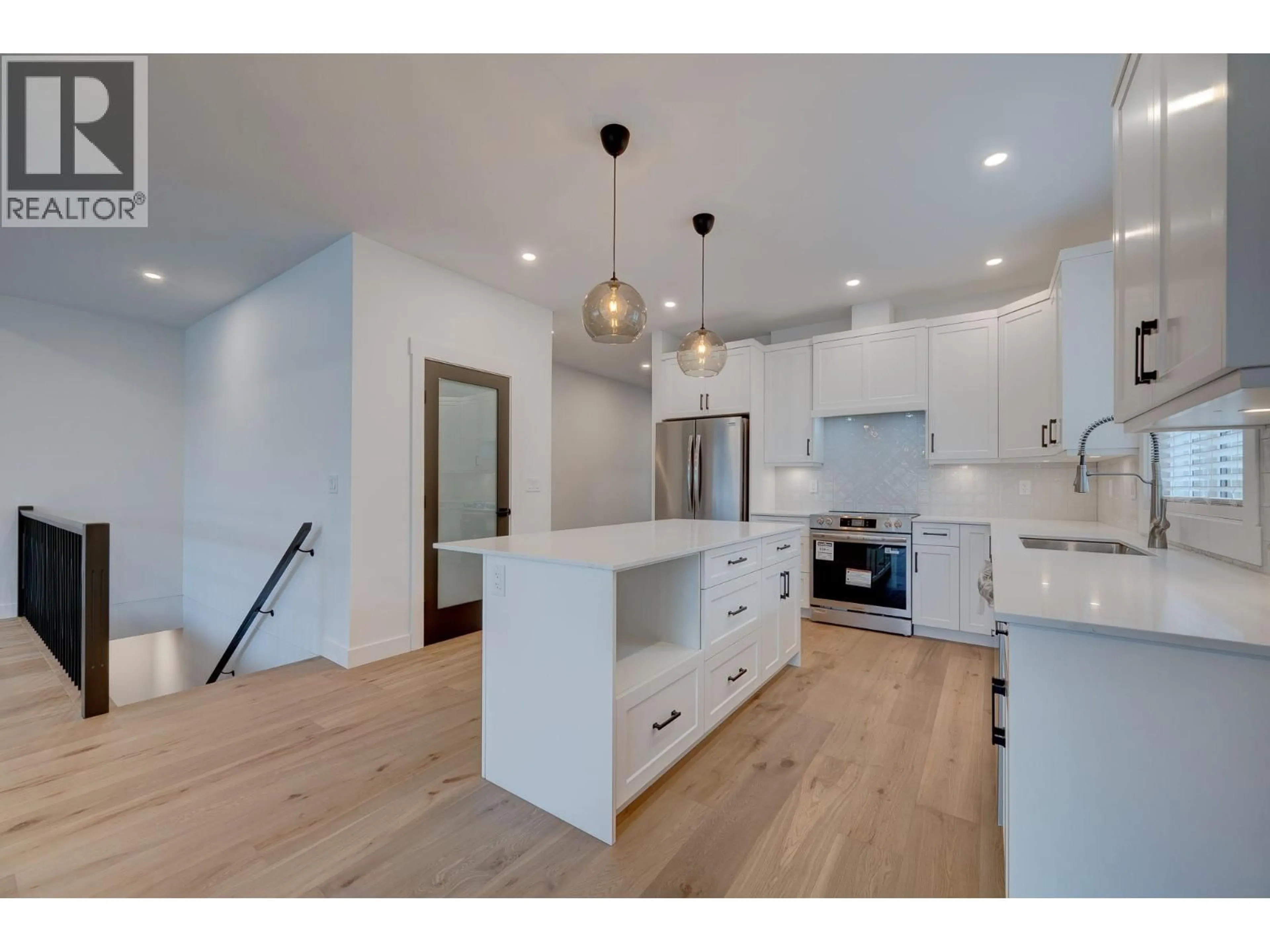 Open concept kitchen, wood/laminate floor for 2244 VALLEYVIEW DRIVE, Kamloops British Columbia V2C4C7
