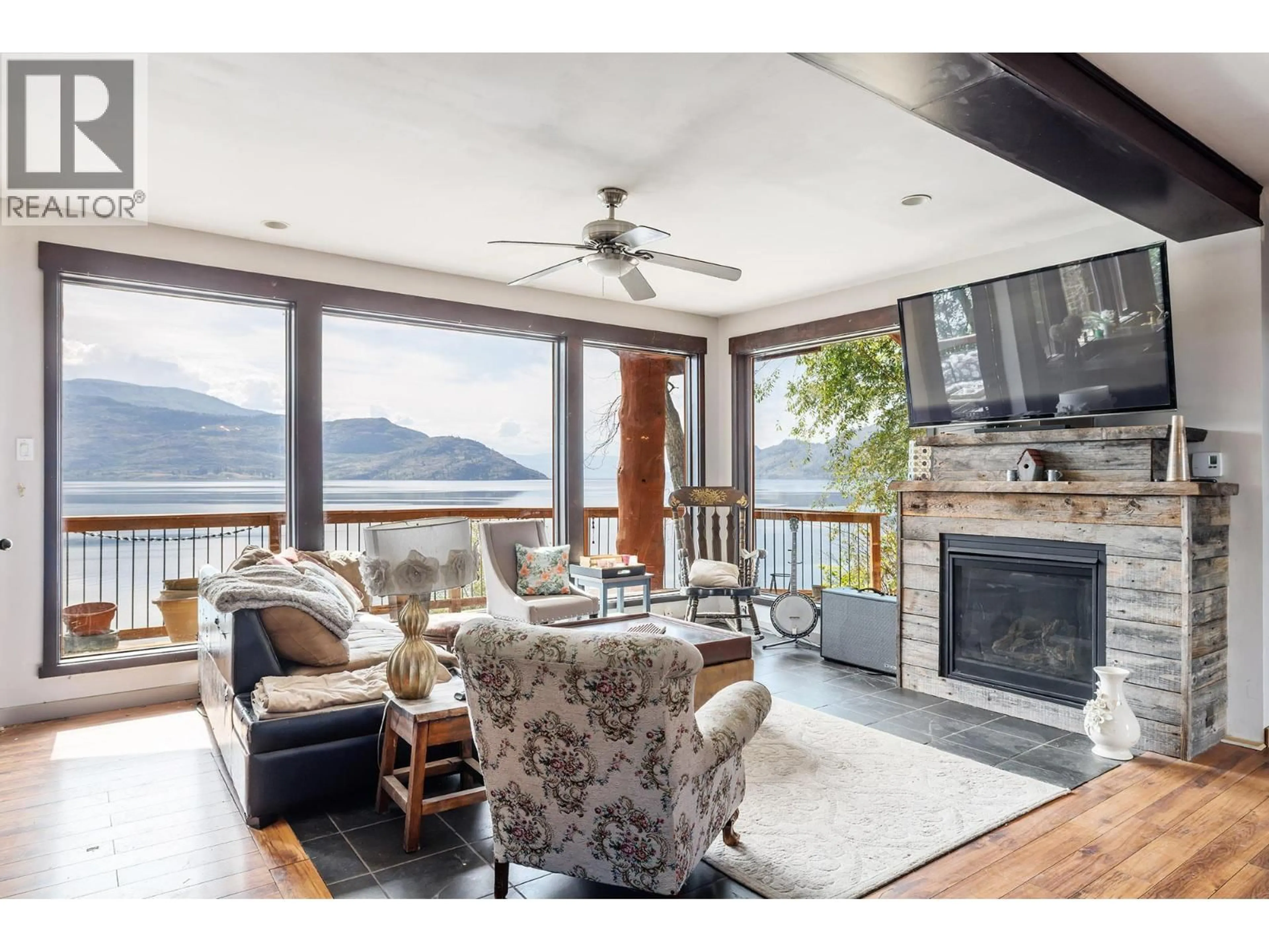 Living room with furniture, wood/laminate floor for 6261 RENFREW ROAD, Peachland British Columbia V0H1X7