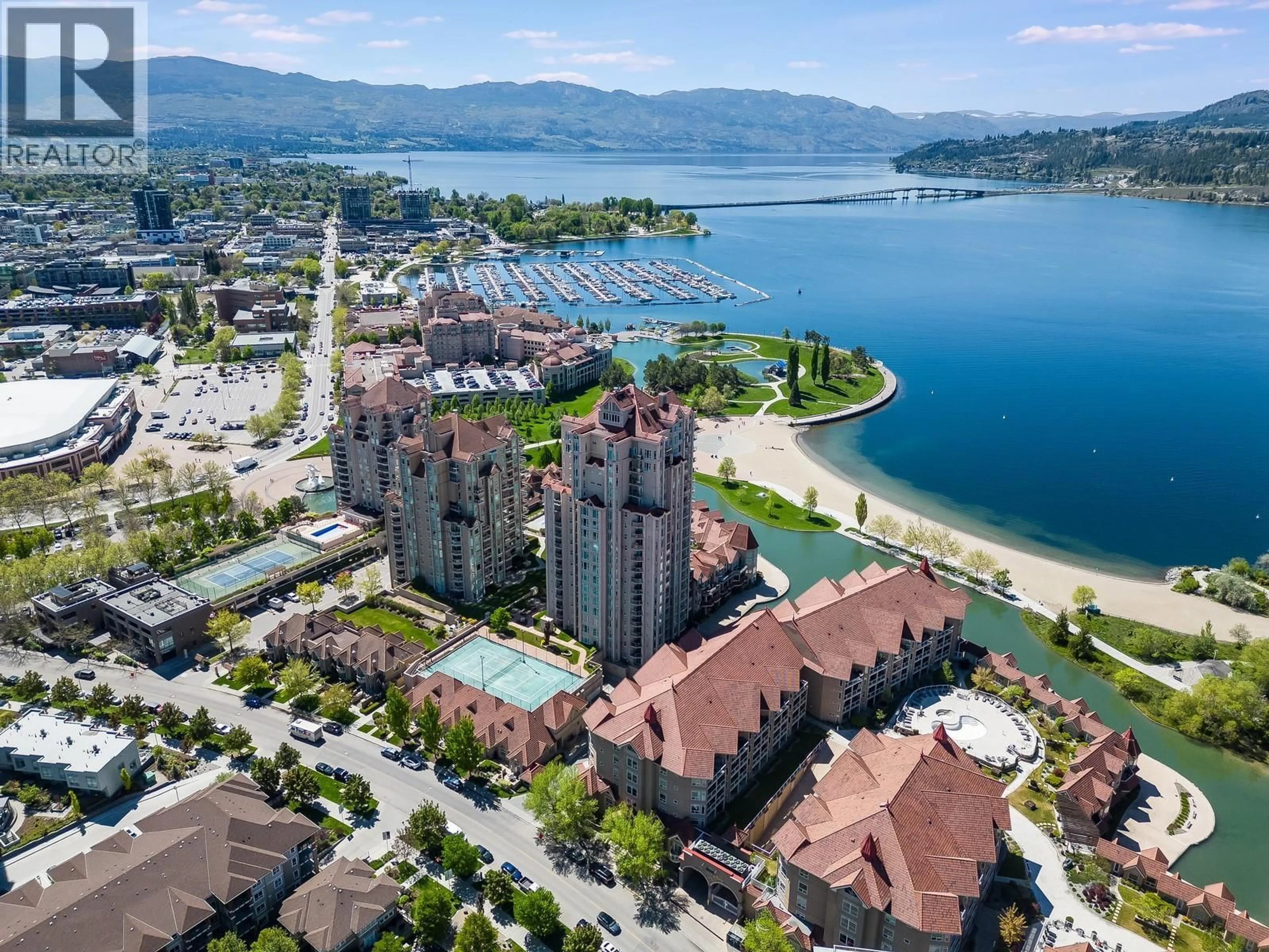 A pic from outside/outdoor area/front of a property/back of a property/a pic from drone, water/lake/river/ocean view for 803 - 1128 SUNSET DRIVE, Kelowna British Columbia V1Y9R7