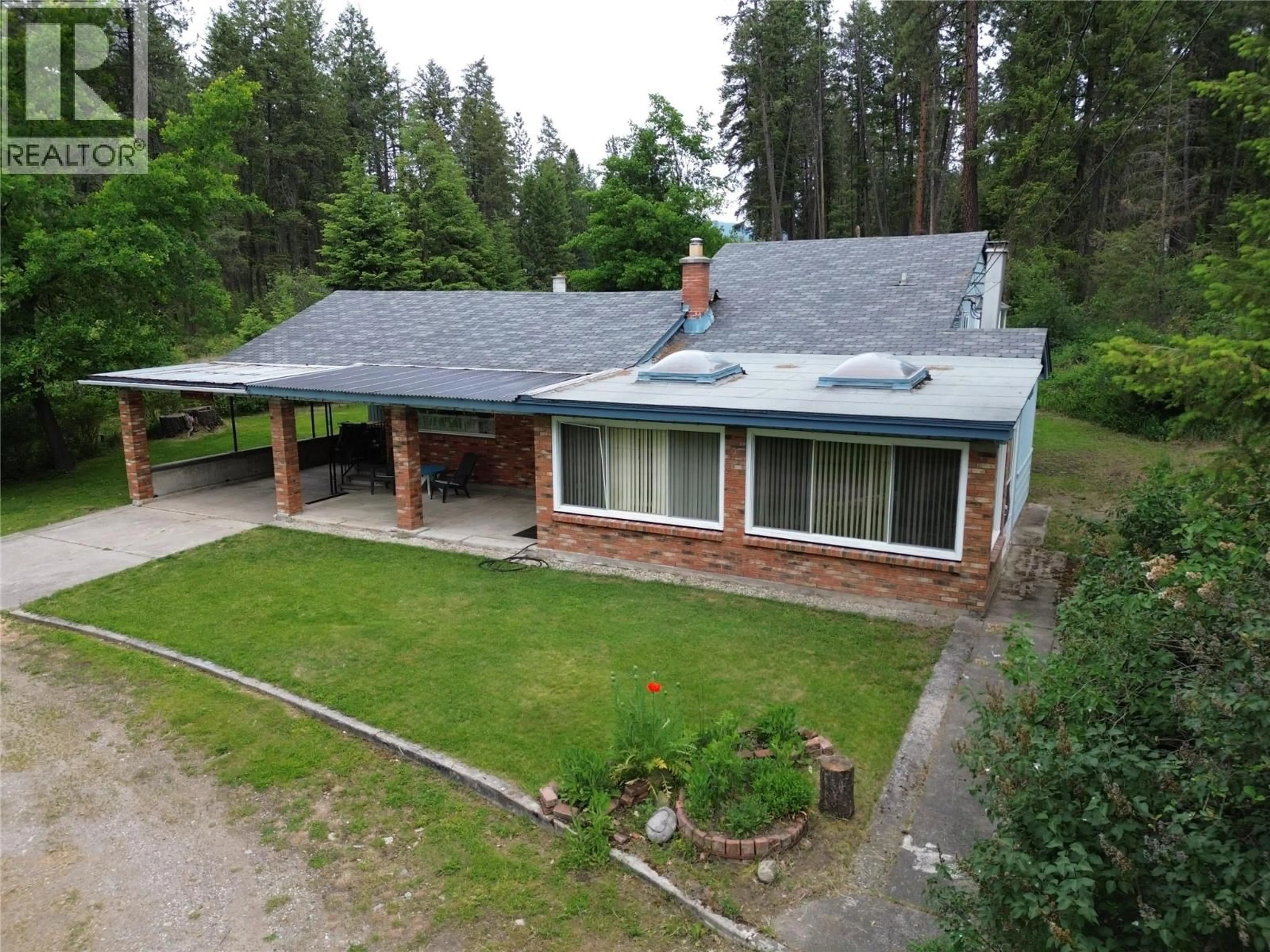 A pic from outside/outdoor area/front of a property/back of a property/a pic from drone, unknown for 1980 3 HIGHWAY, Christina Lake British Columbia V0H1E2