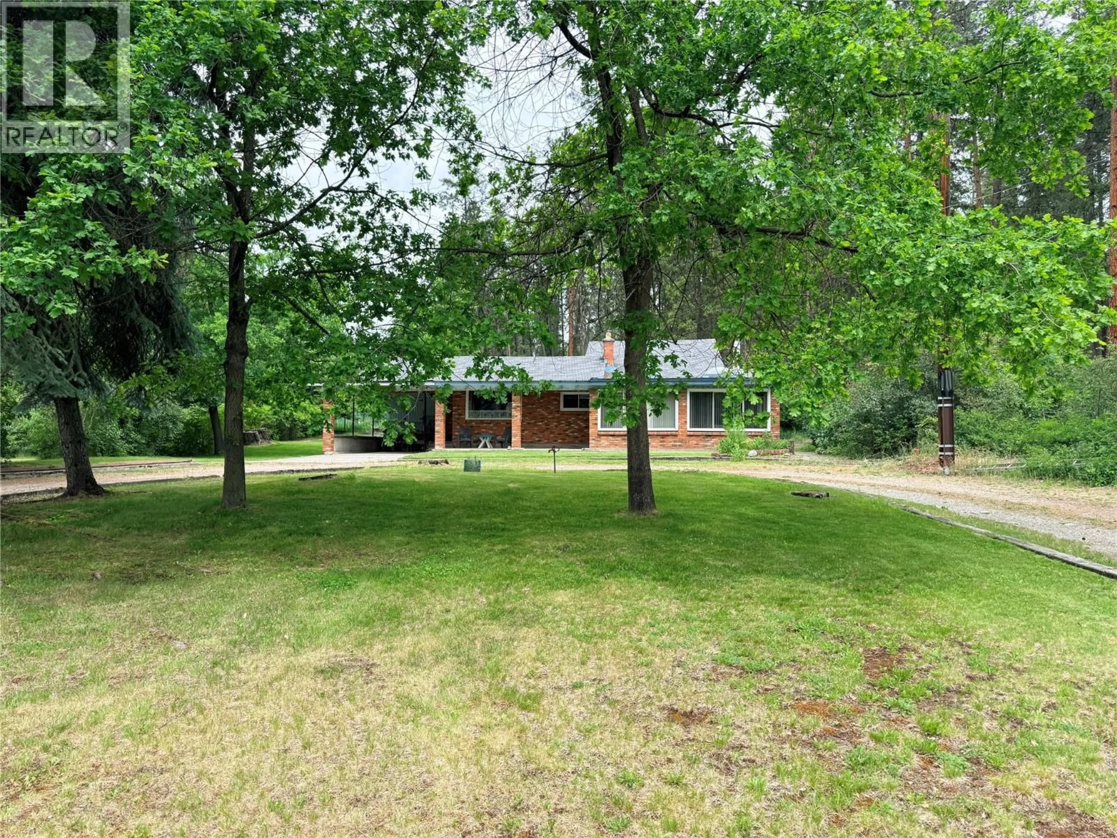 A pic from outside/outdoor area/front of a property/back of a property/a pic from drone, forest/trees view for 1980 3 HIGHWAY, Christina Lake British Columbia V0H1E2