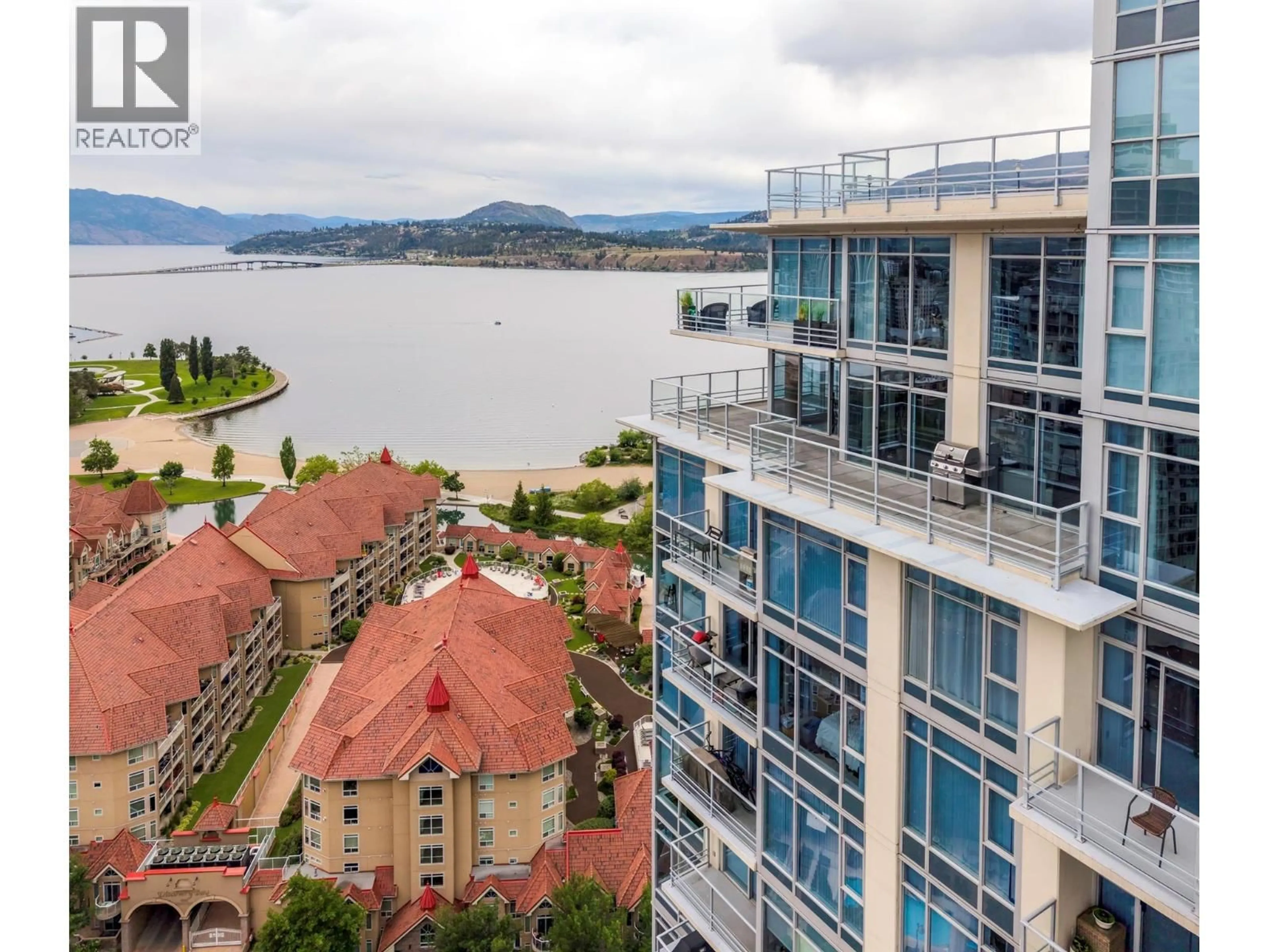 A pic from outside/outdoor area/front of a property/back of a property/a pic from drone, water/lake/river/ocean view for 2603 - 1075 SUNSET DRIVE, Kelowna British Columbia V1Y9Y9