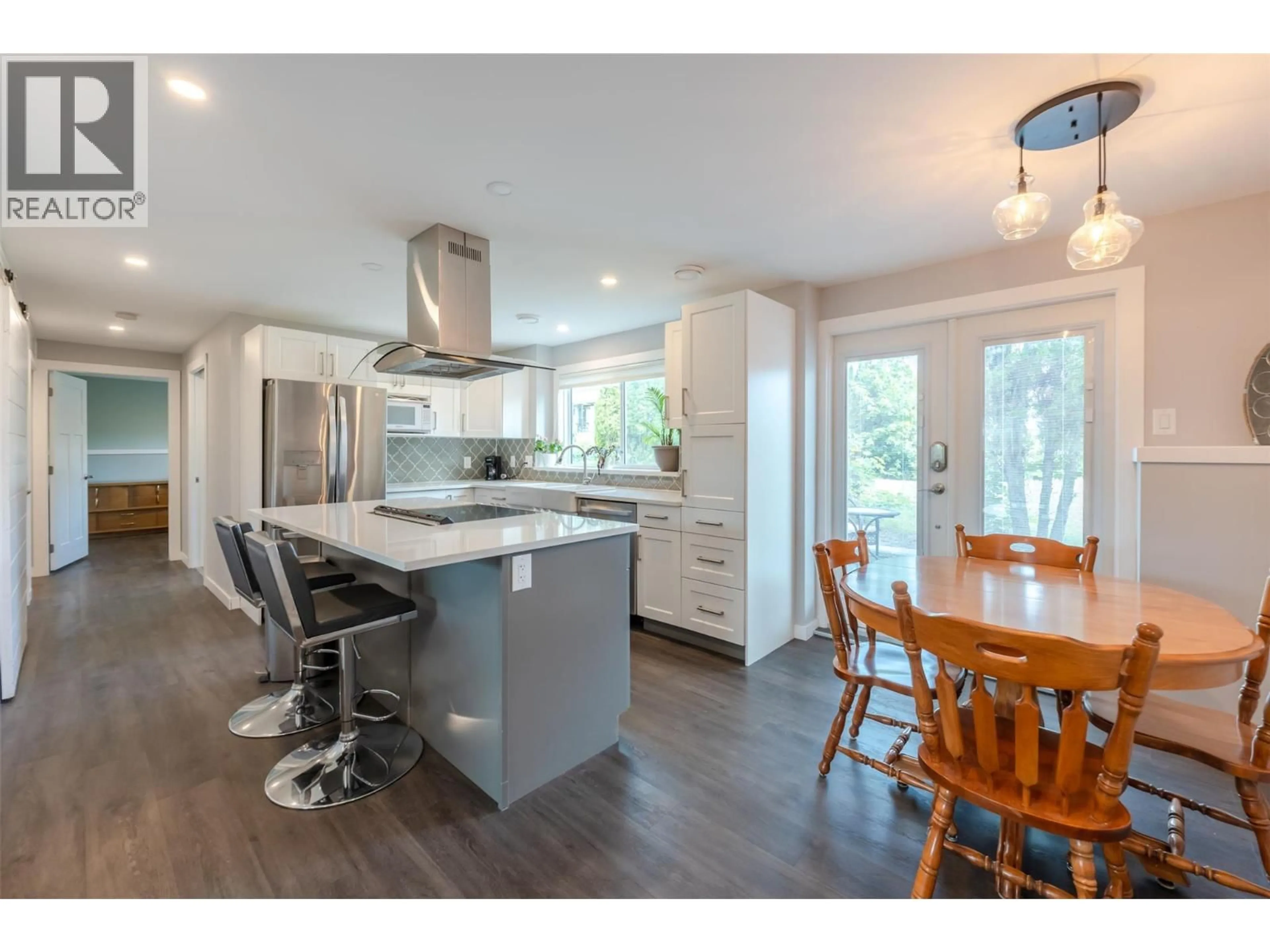 Open concept kitchen, wood/laminate floor for 11512 HARVEY STREET, Summerland British Columbia V0h1Z0