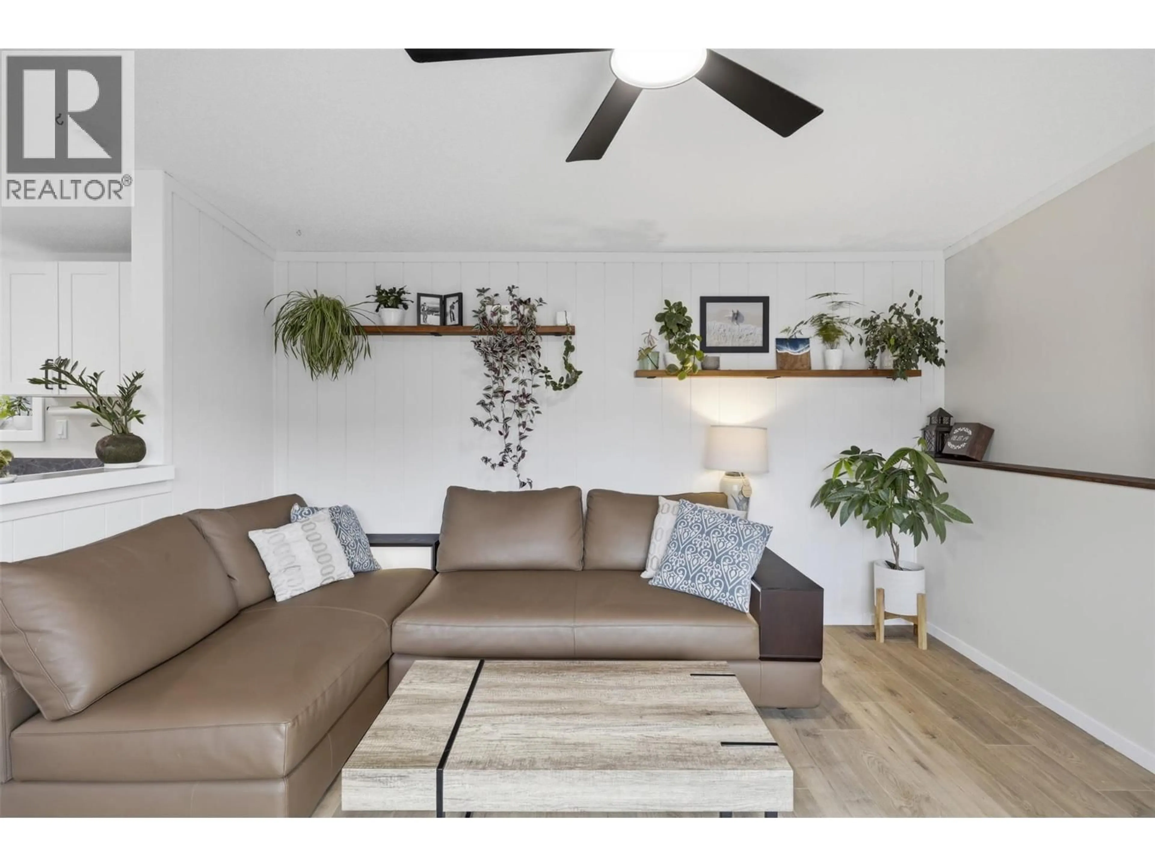 Living room with furniture, wood/laminate floor for 840 KLAHANIE DRIVE, Kamloops British Columbia V2C5R2