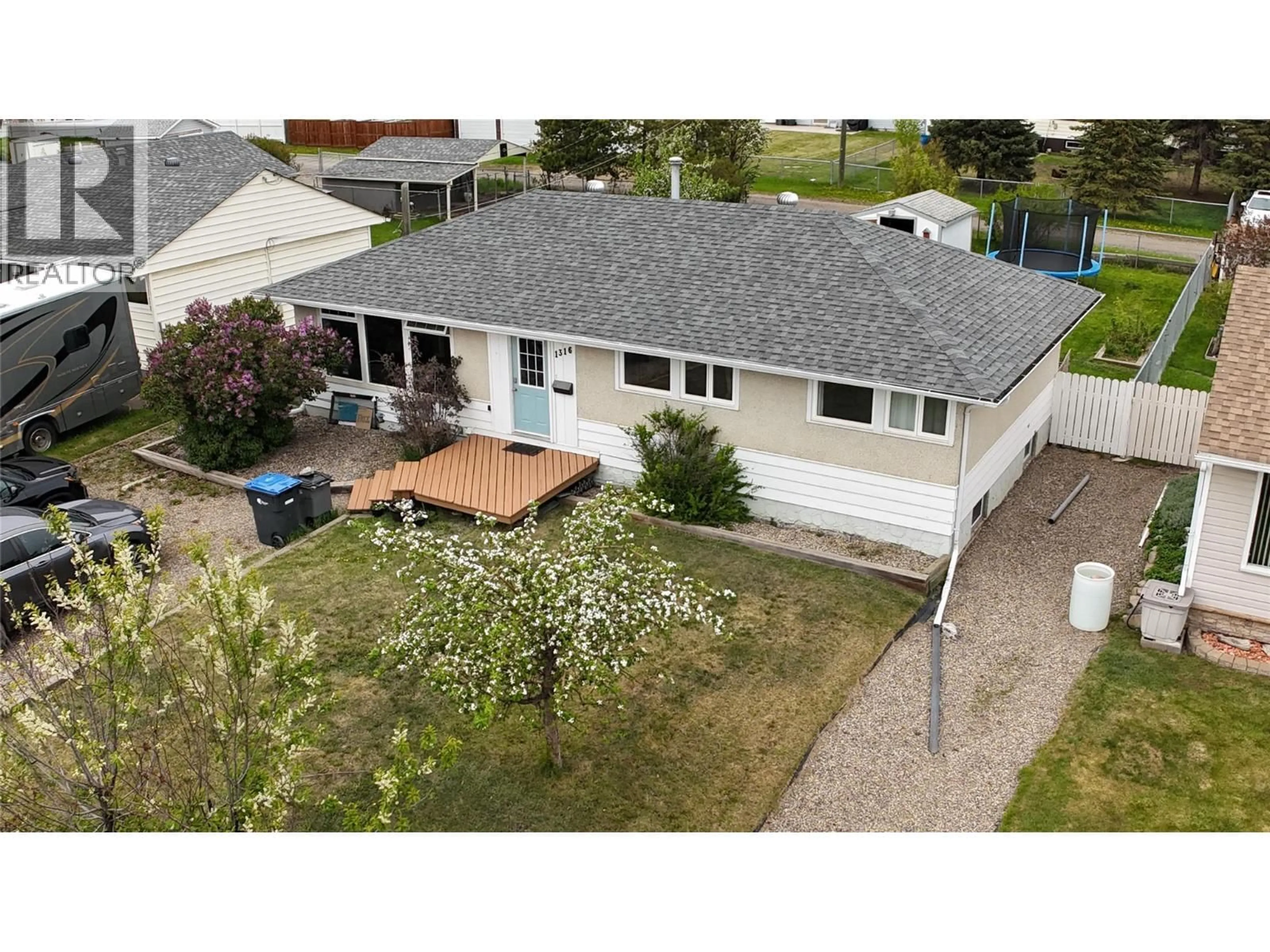 A pic from outside/outdoor area/front of a property/back of a property/a pic from drone, street for 1316 93 AVENUE, Dawson Creek British Columbia V1G1E4