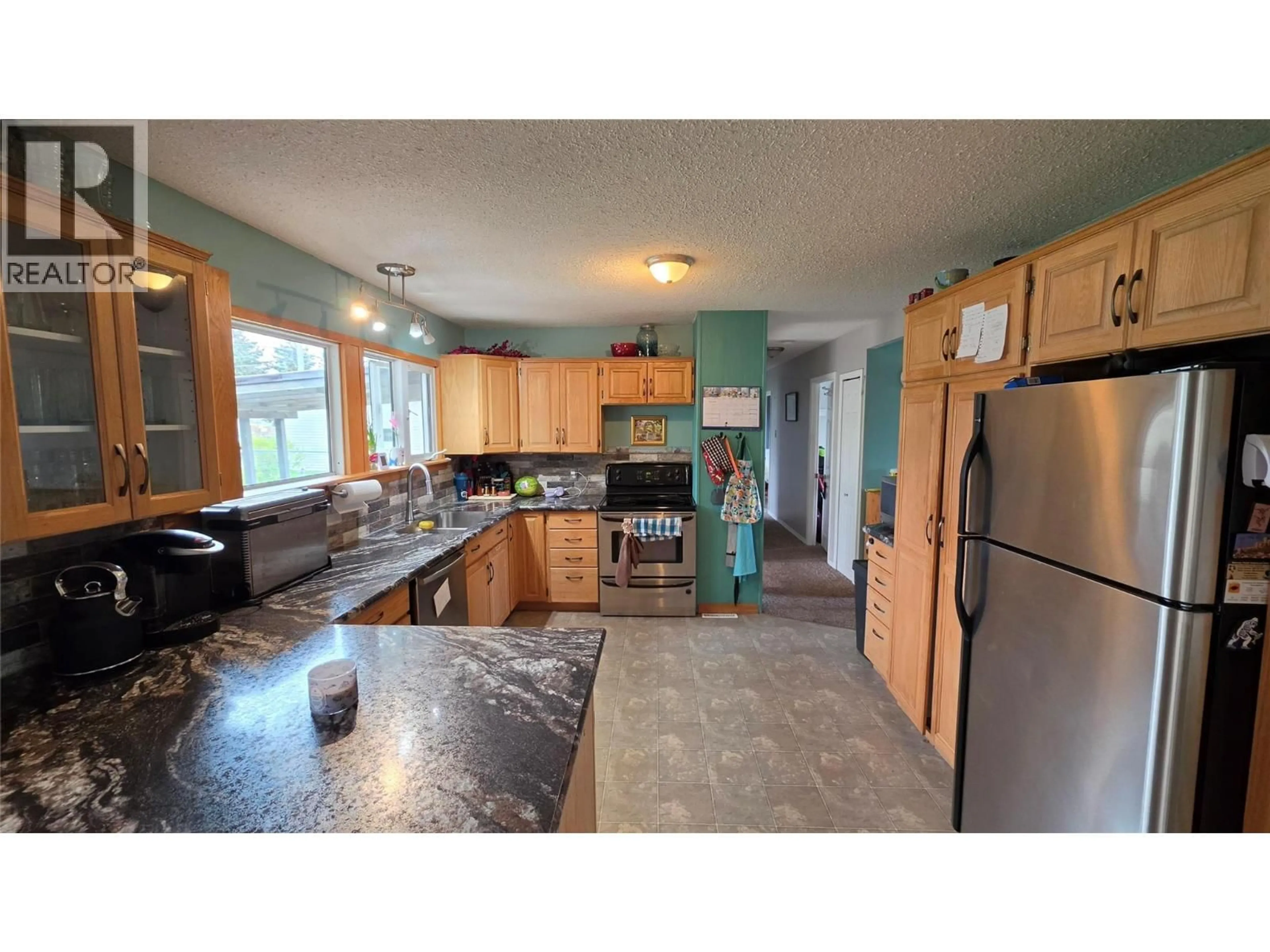 Open concept kitchen, unknown for 1316 93 AVENUE, Dawson Creek British Columbia V1G1E4