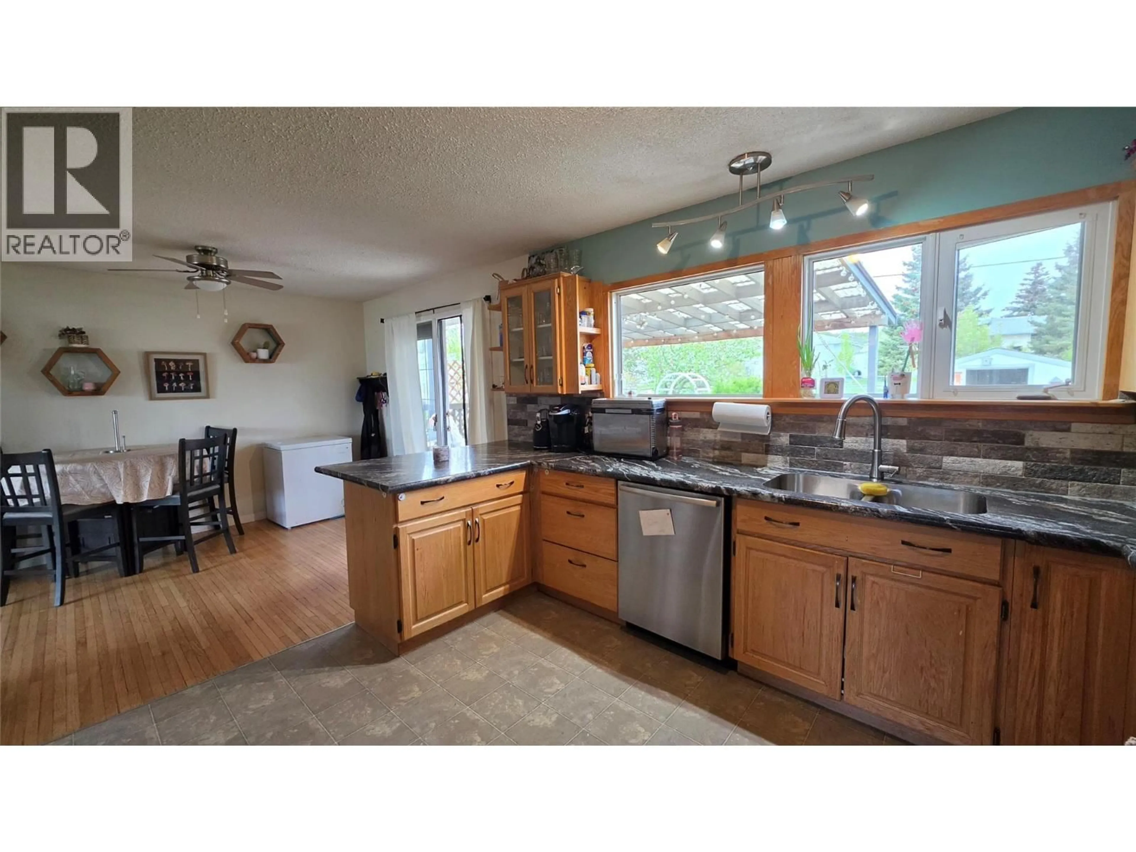Open concept kitchen, unknown for 1316 93 AVENUE, Dawson Creek British Columbia V1G1E4