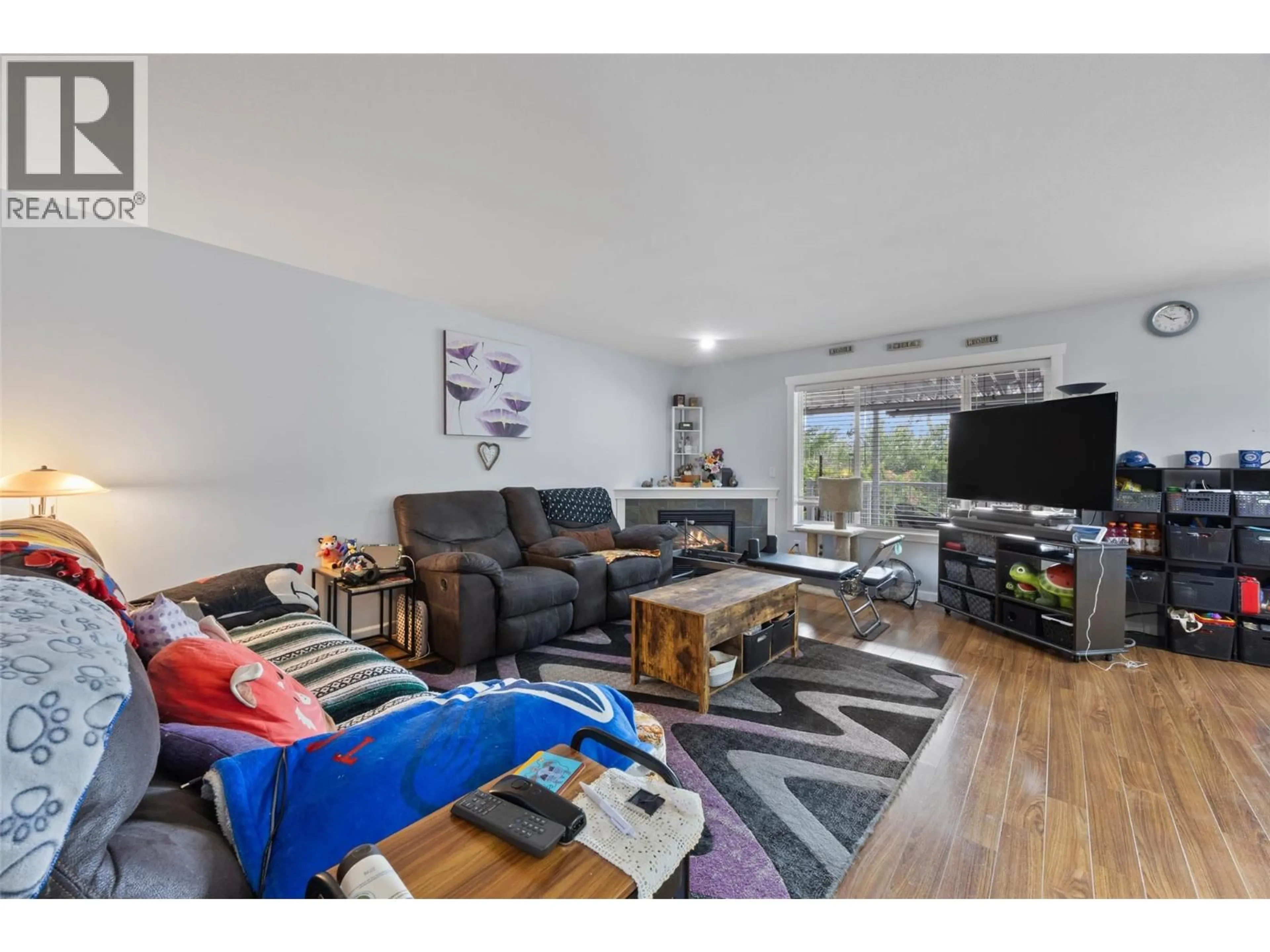 Living room with furniture, wood/laminate floor for 840 NICOLANI DRIVE, Kamloops British Columbia V2B5B3