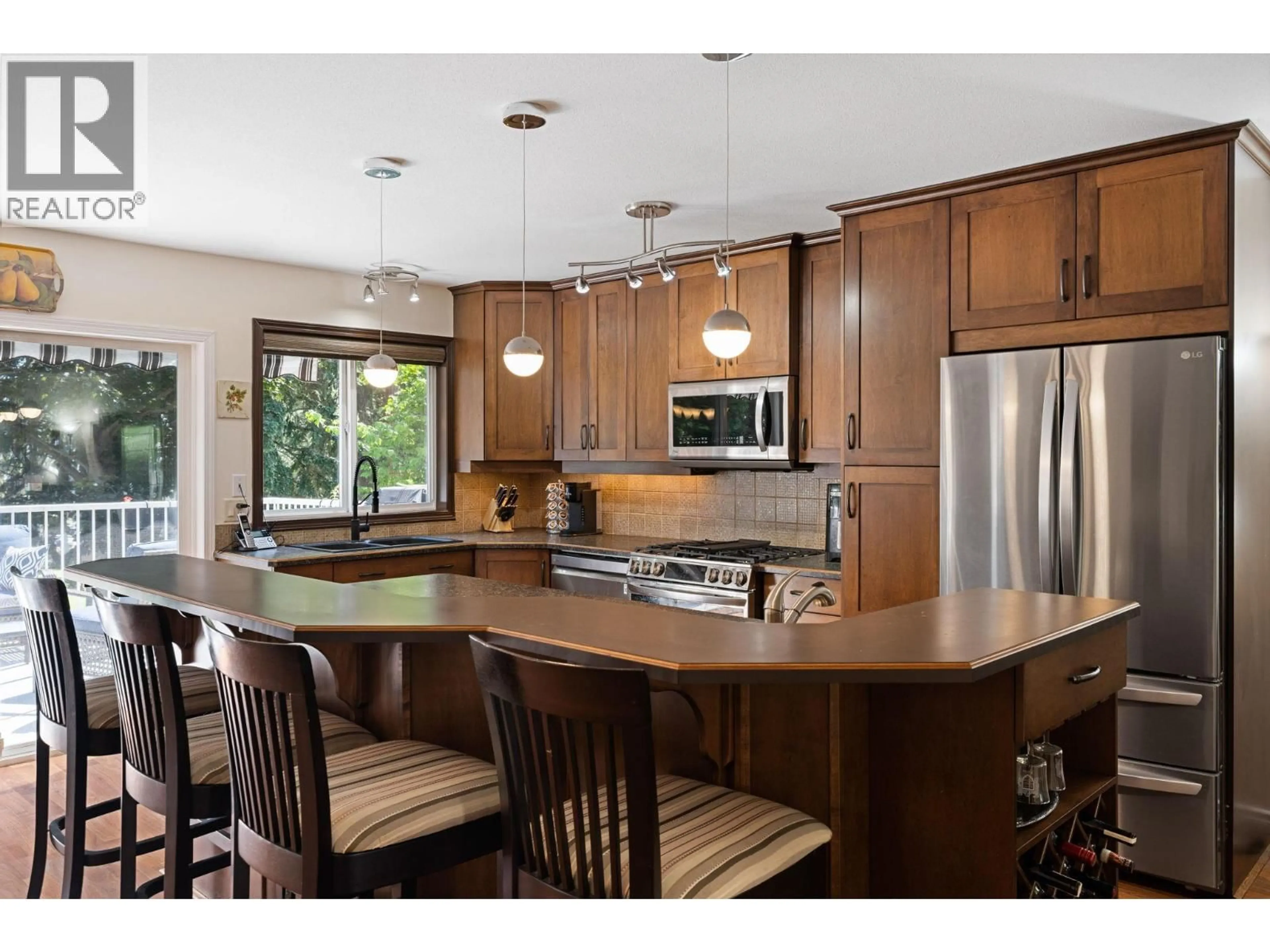 Open concept kitchen, wood/laminate floor for 2211 SHANNON WOODS PLACE, West Kelowna British Columbia V4T2L9