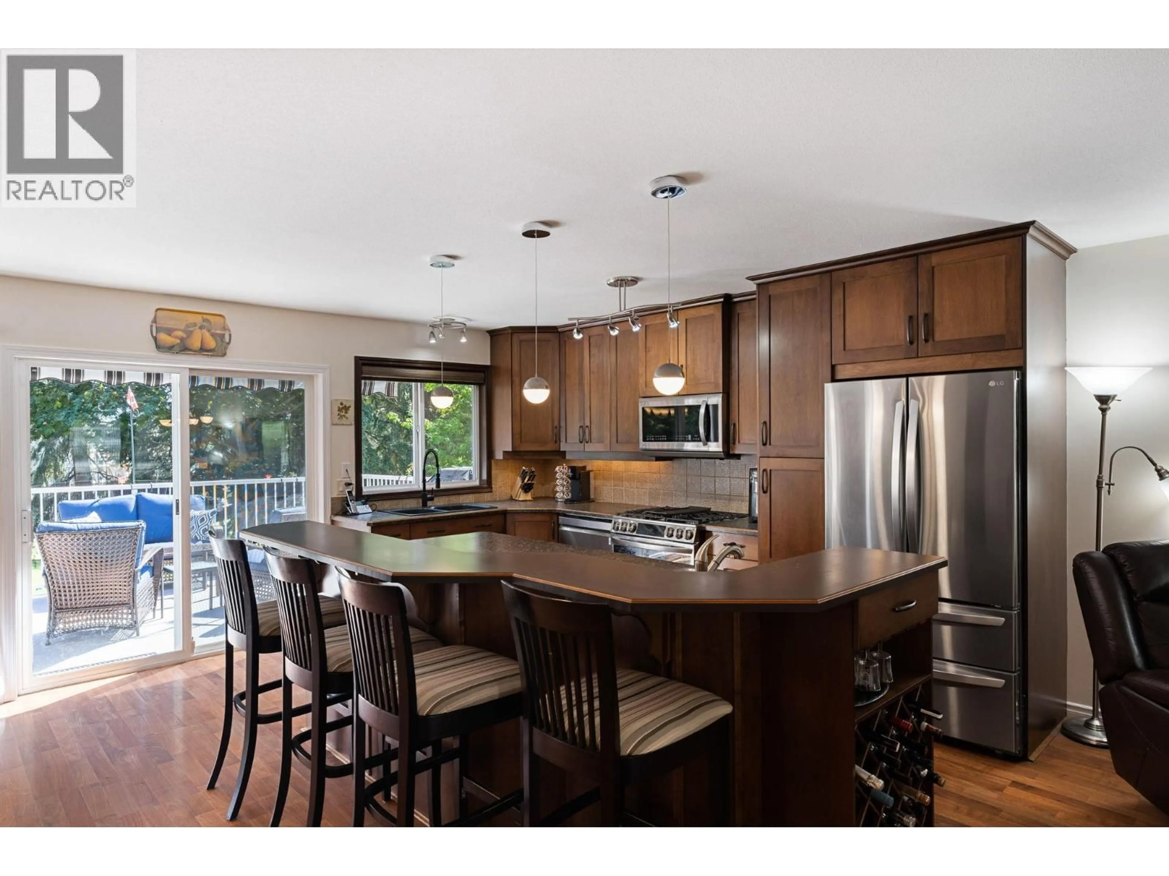 Open concept kitchen, wood/laminate floor for 2211 SHANNON WOODS PLACE, West Kelowna British Columbia V4T2L9