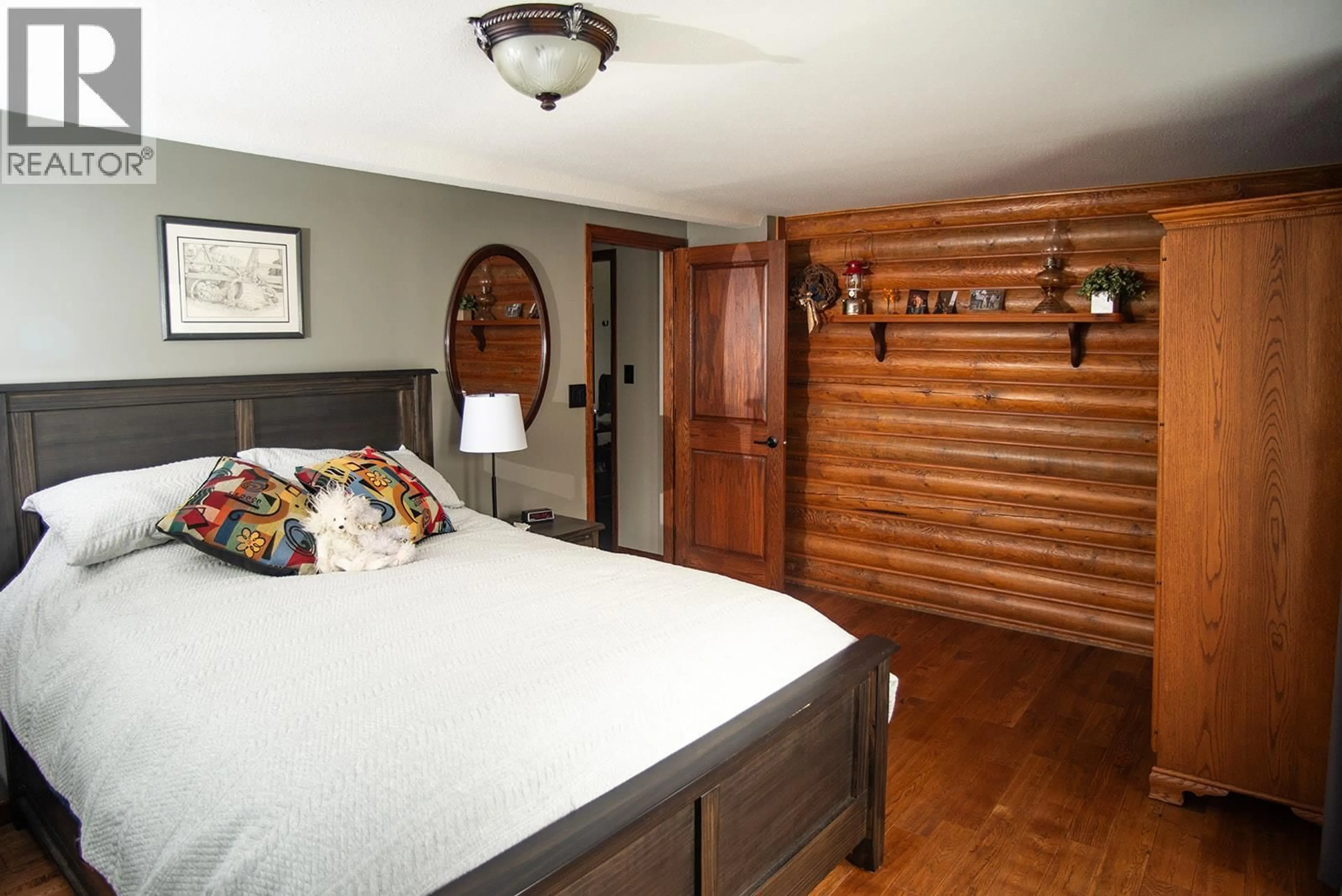 Bedroom with bed, wood/laminate floor for 3622-3632 208 ROAD, Dawson Creek British Columbia V1G5A1