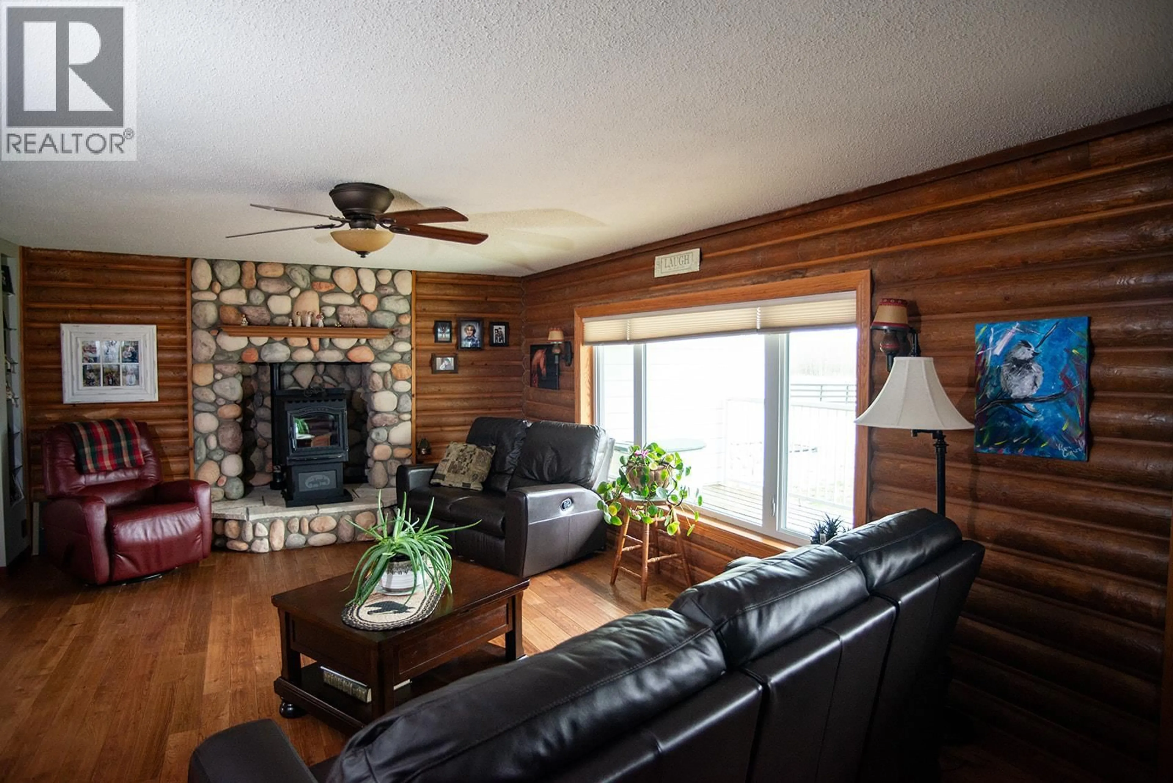 Living room with furniture, wood/laminate floor for 3622-3632 208 ROAD, Dawson Creek British Columbia V1G5A1