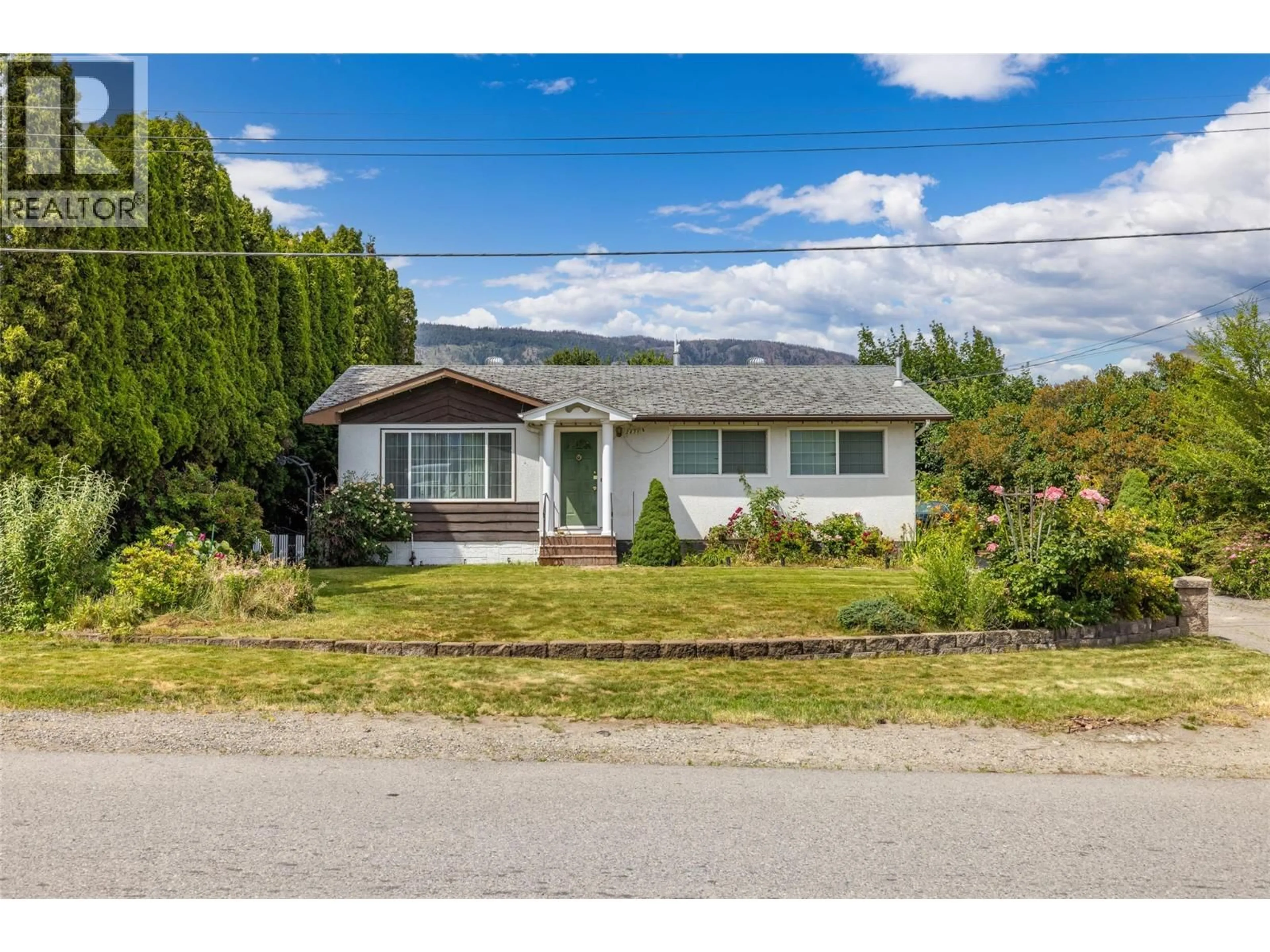 Home with vinyl exterior material, street for 2436 APOLLO ROAD, West Kelowna British Columbia V4T1P7