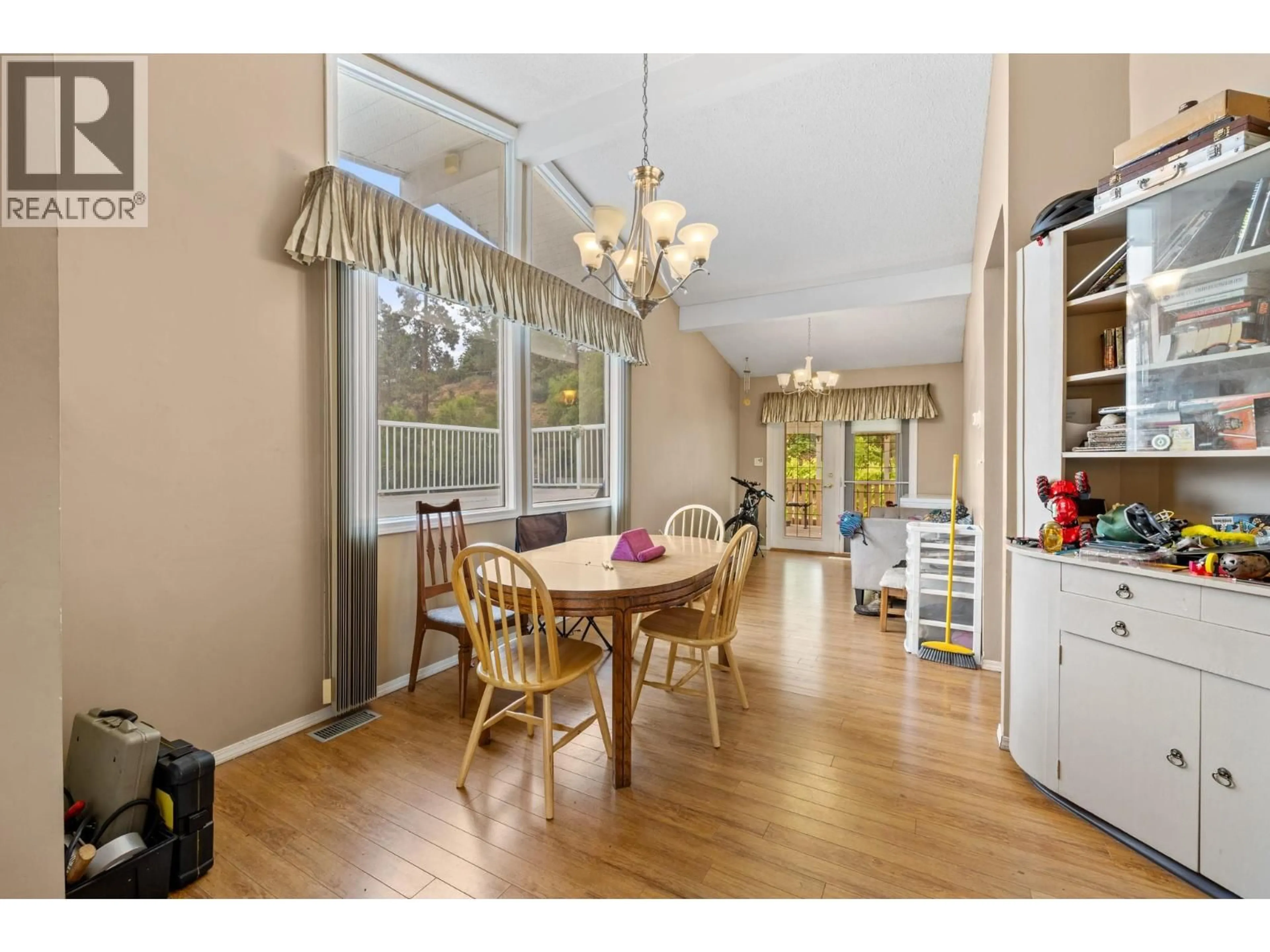 Dining room, wood/laminate floor for 575 DELL ROAD, Kelowna British Columbia V1X3P7