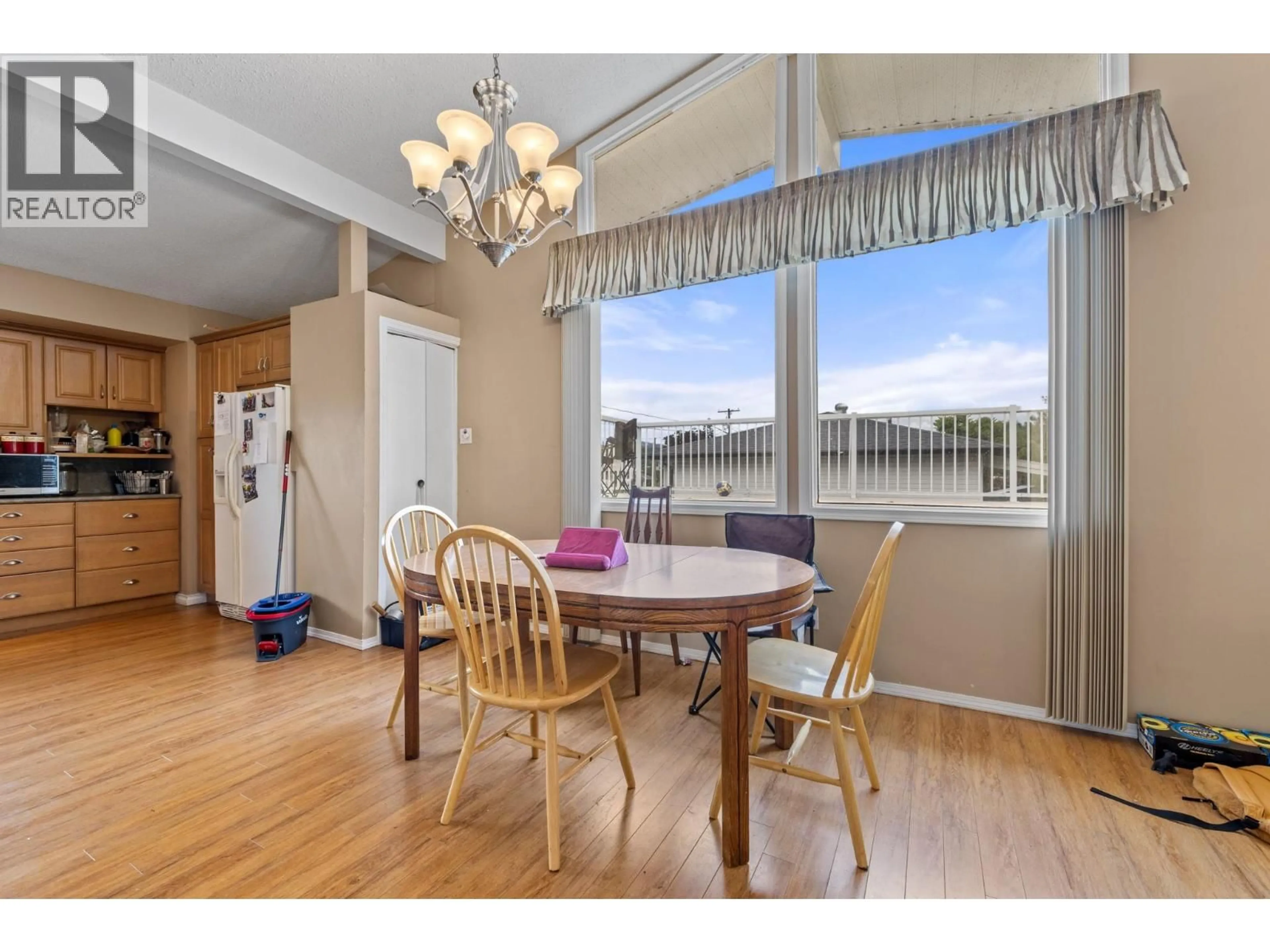 Dining room, wood/laminate floor for 575 DELL ROAD, Kelowna British Columbia V1X3P7