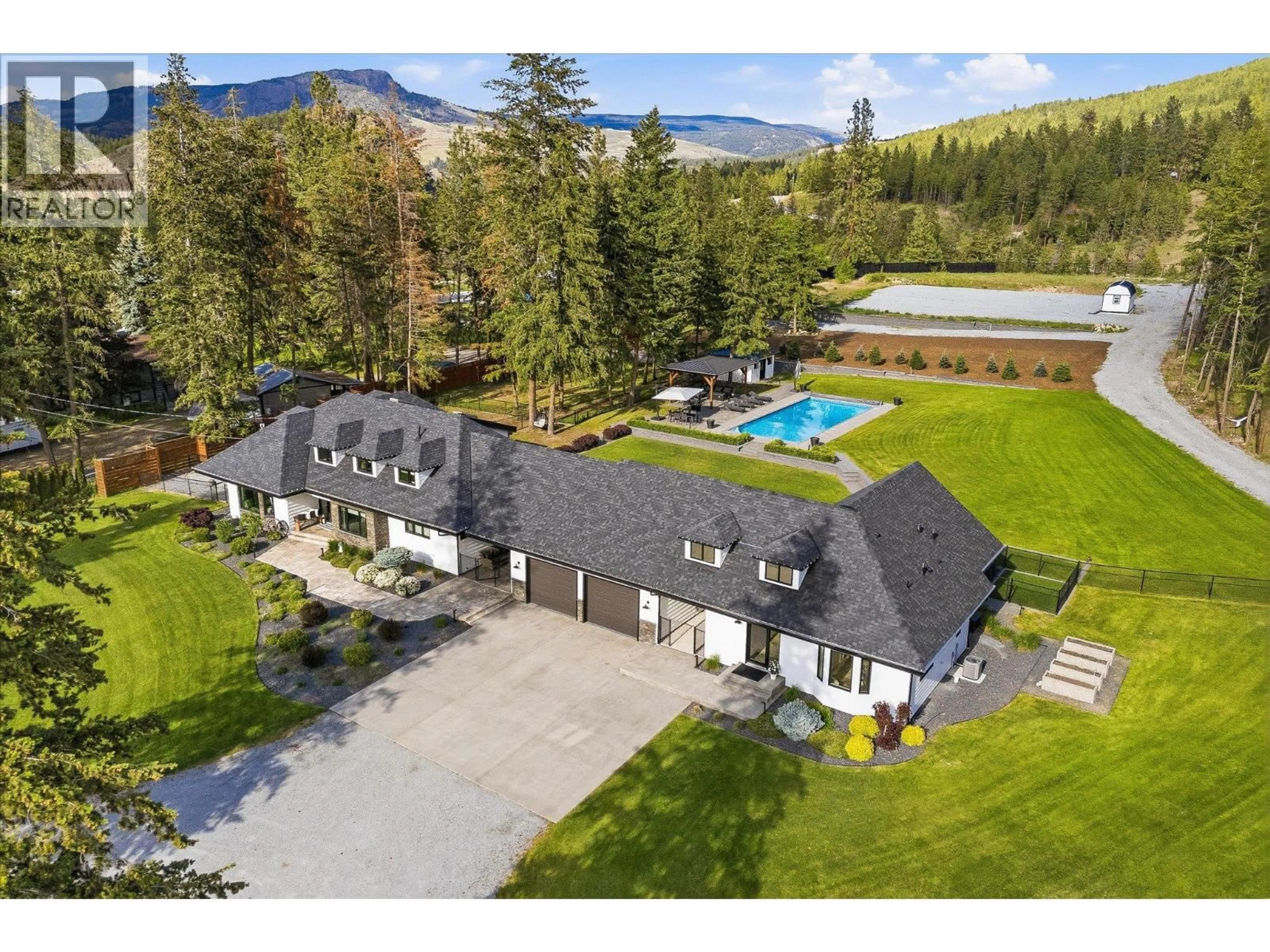 A pic from outside/outdoor area/front of a property/back of a property/a pic from drone, mountain view for 4155 FIELD ROAD, Kelowna British Columbia V1W4G1