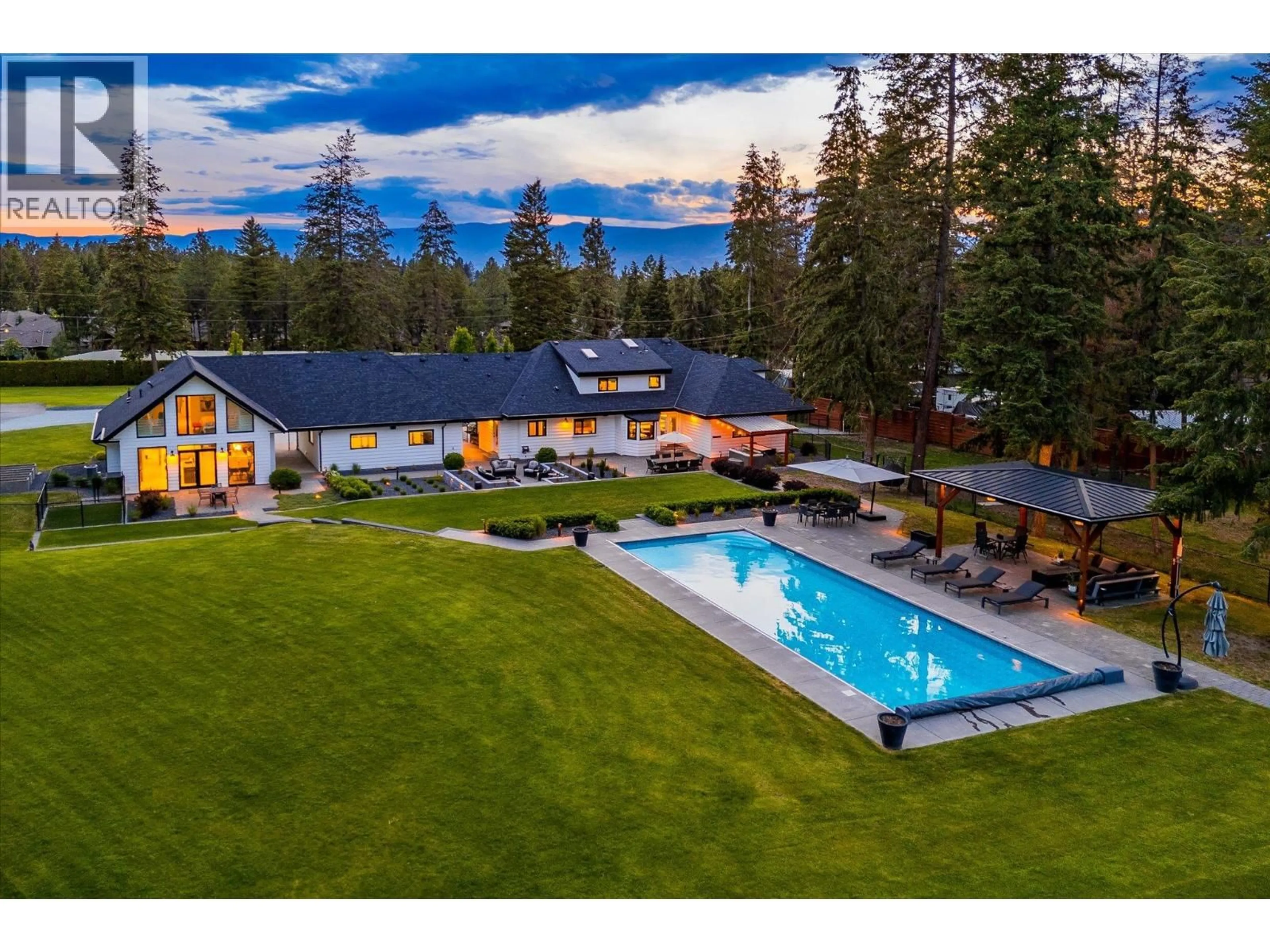 A pic from outside/outdoor area/front of a property/back of a property/a pic from drone, mountain view for 4155 FIELD ROAD, Kelowna British Columbia V1W4G1