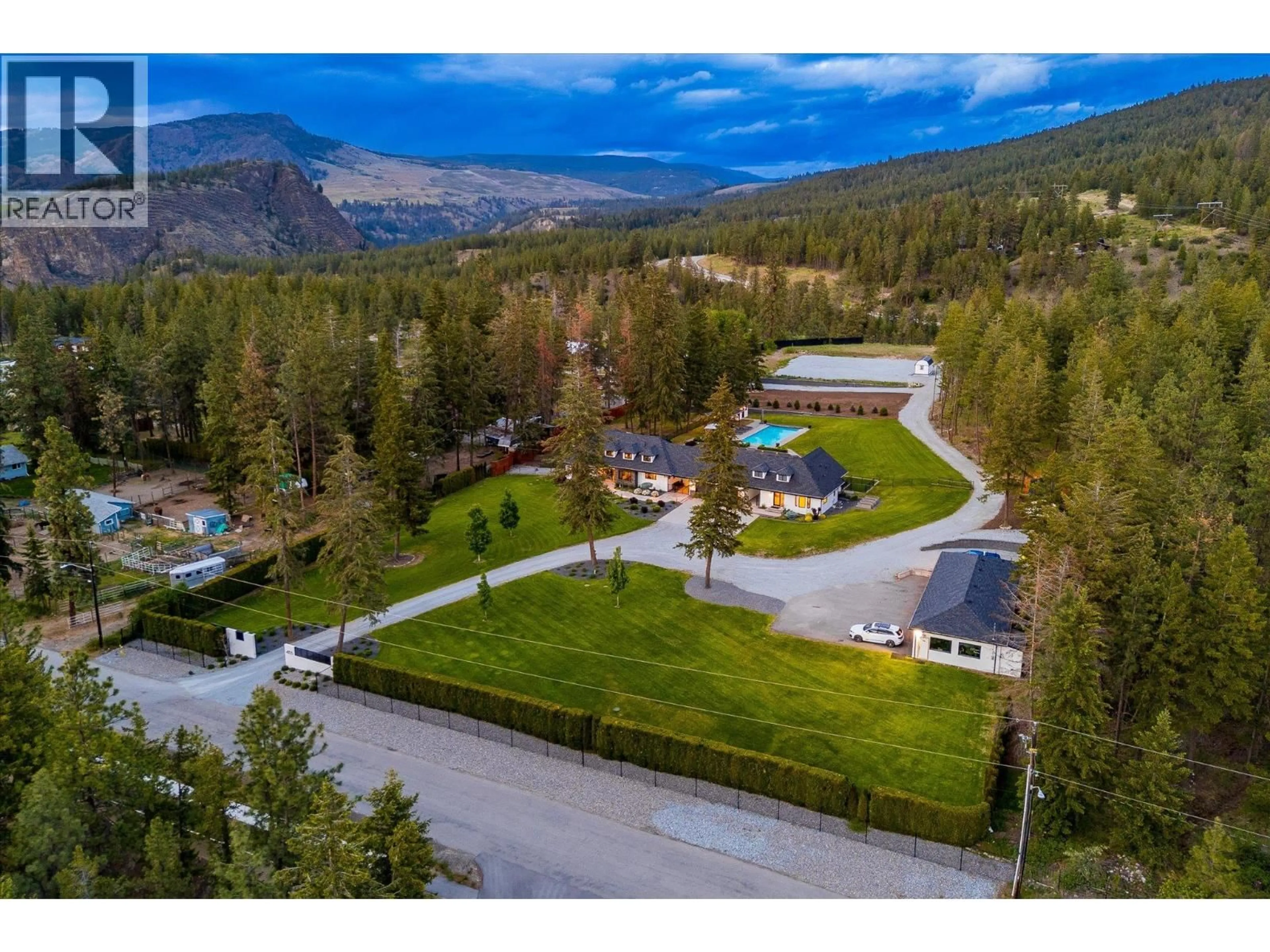 A pic from outside/outdoor area/front of a property/back of a property/a pic from drone, mountain view for 4155 FIELD ROAD, Kelowna British Columbia V1W4G1