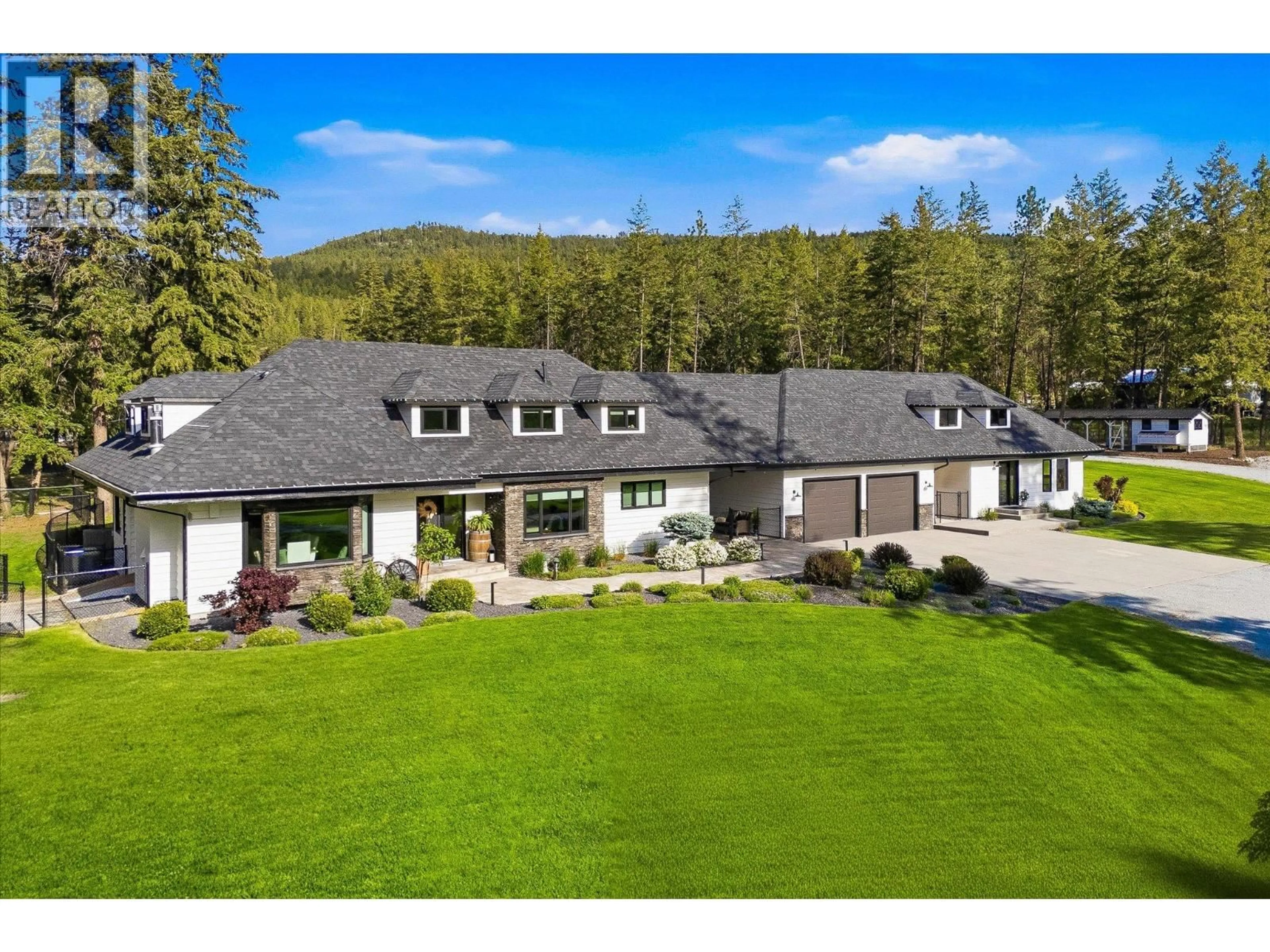 A pic from outside/outdoor area/front of a property/back of a property/a pic from drone, mountain view for 4155 FIELD ROAD, Kelowna British Columbia V1W4G1