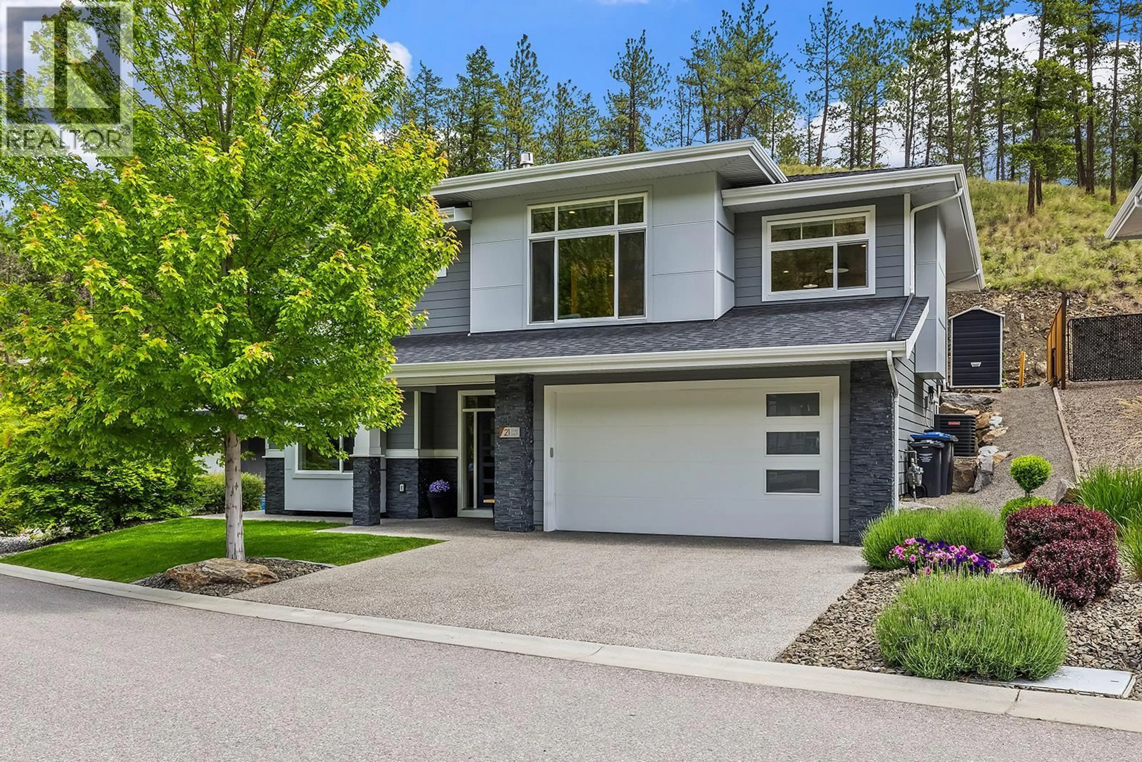 Home with vinyl exterior material, street for 21 FOREST EDGE DRIVE, Kelowna British Columbia V1V3G3