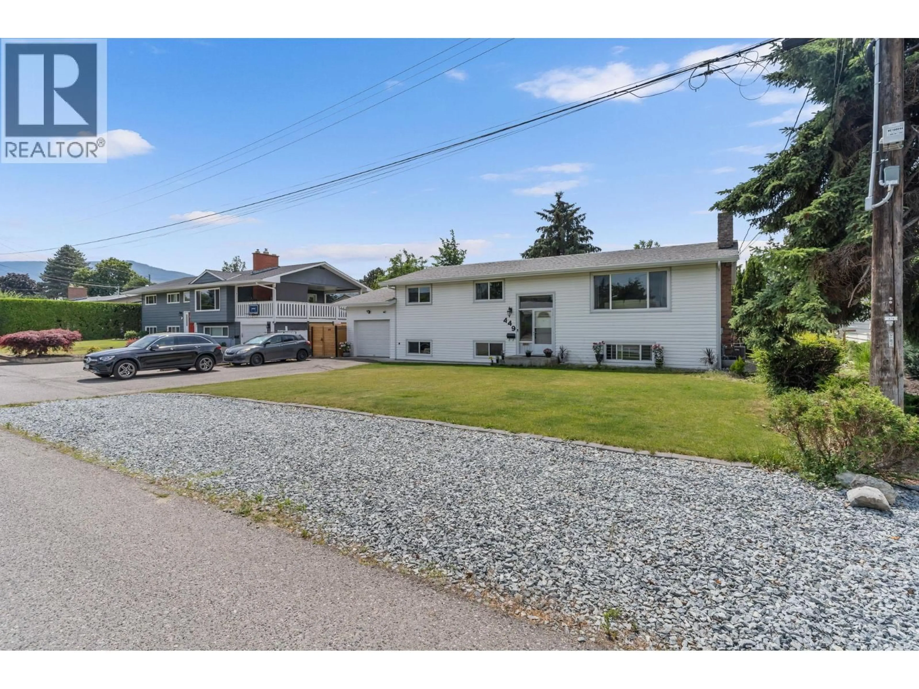 A pic from outside/outdoor area/front of a property/back of a property/a pic from drone, street for 449 BARKLEY ROAD, Kelowna British Columbia V1W1E4