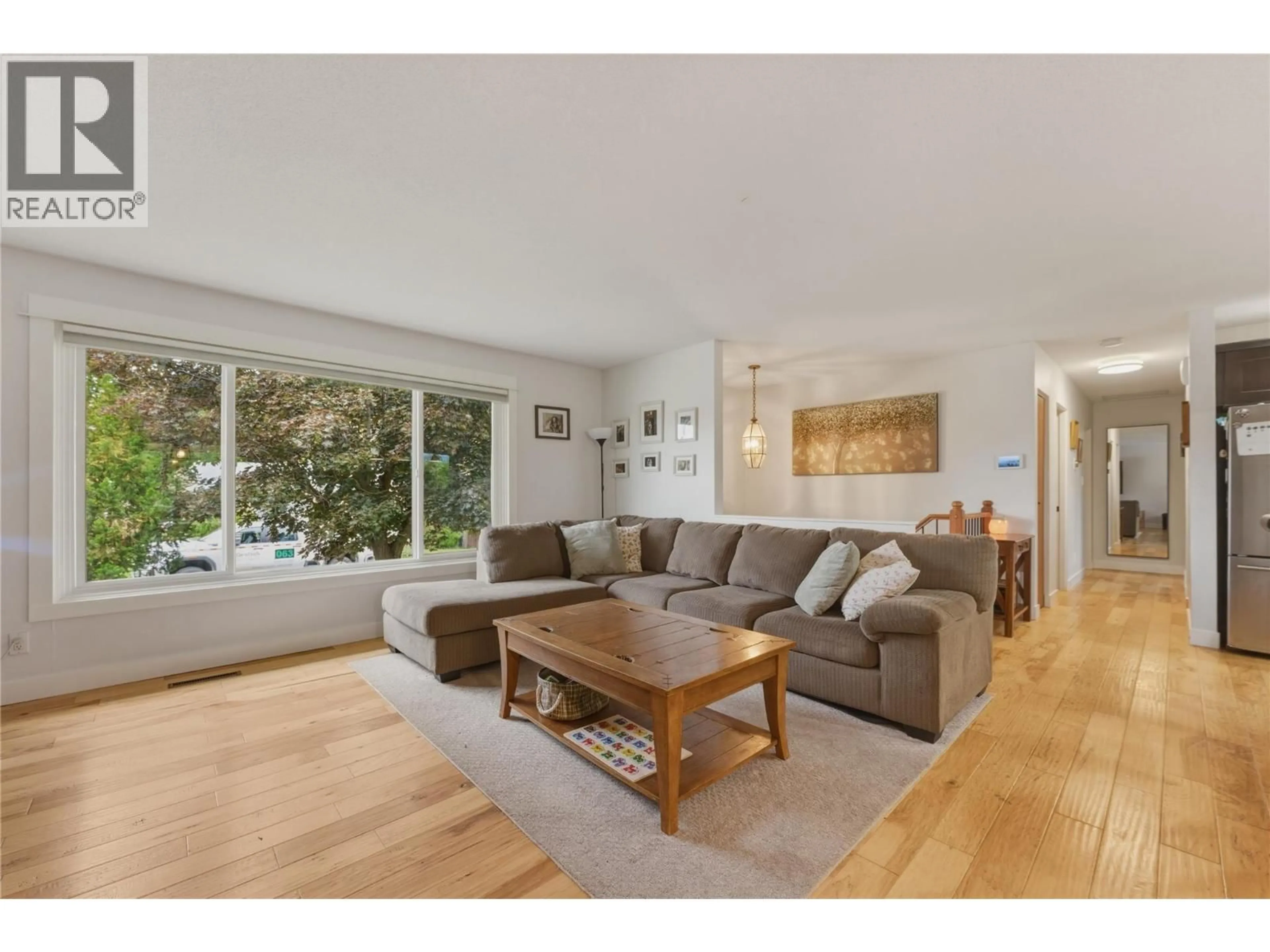 Living room with furniture, wood/laminate floor for 4101 35 A STREET, Vernon British Columbia V1T6C7