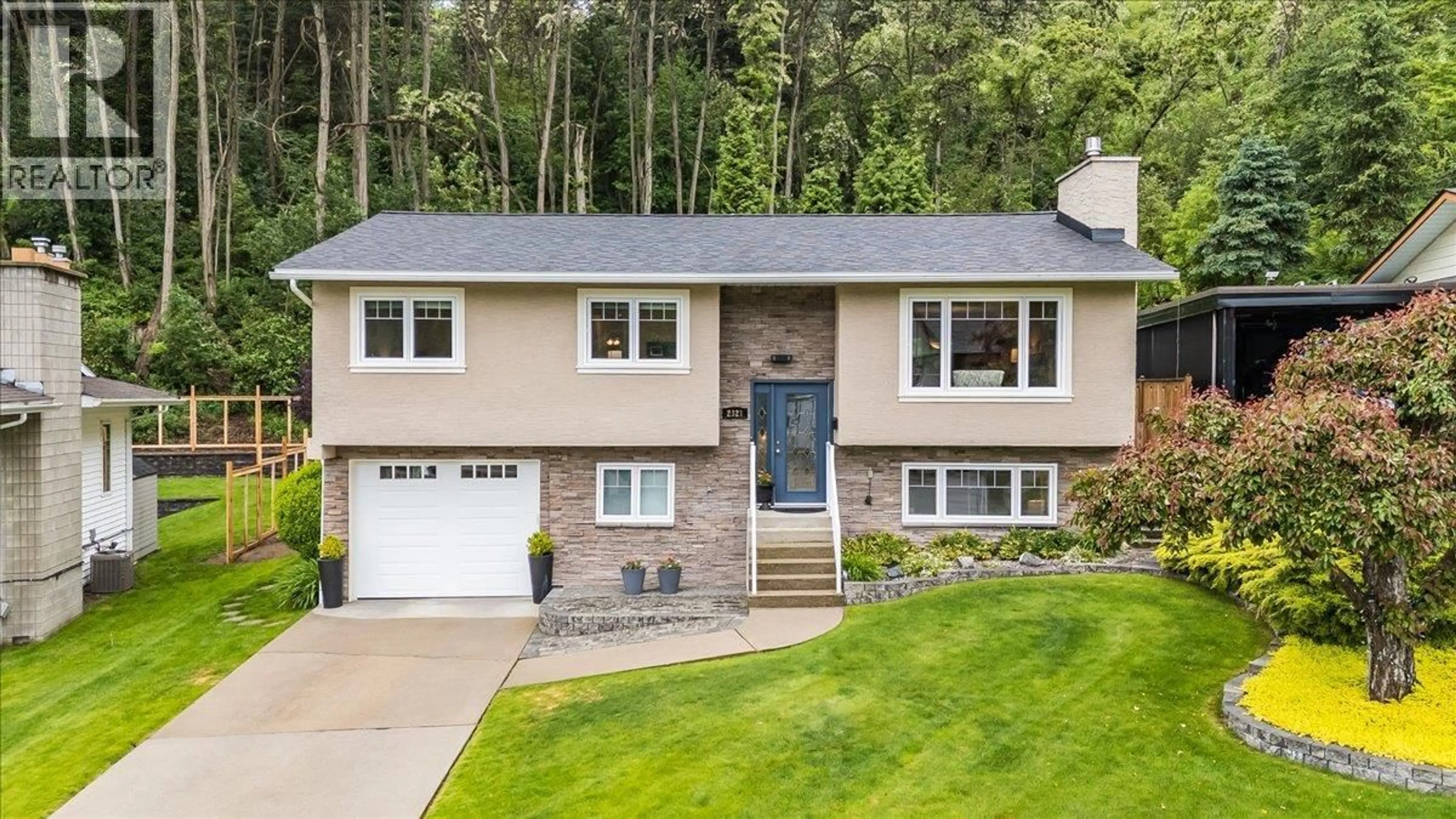 Home with vinyl exterior material, street for 2321 MCBRIDE STREET, Trail British Columbia V1R3A6