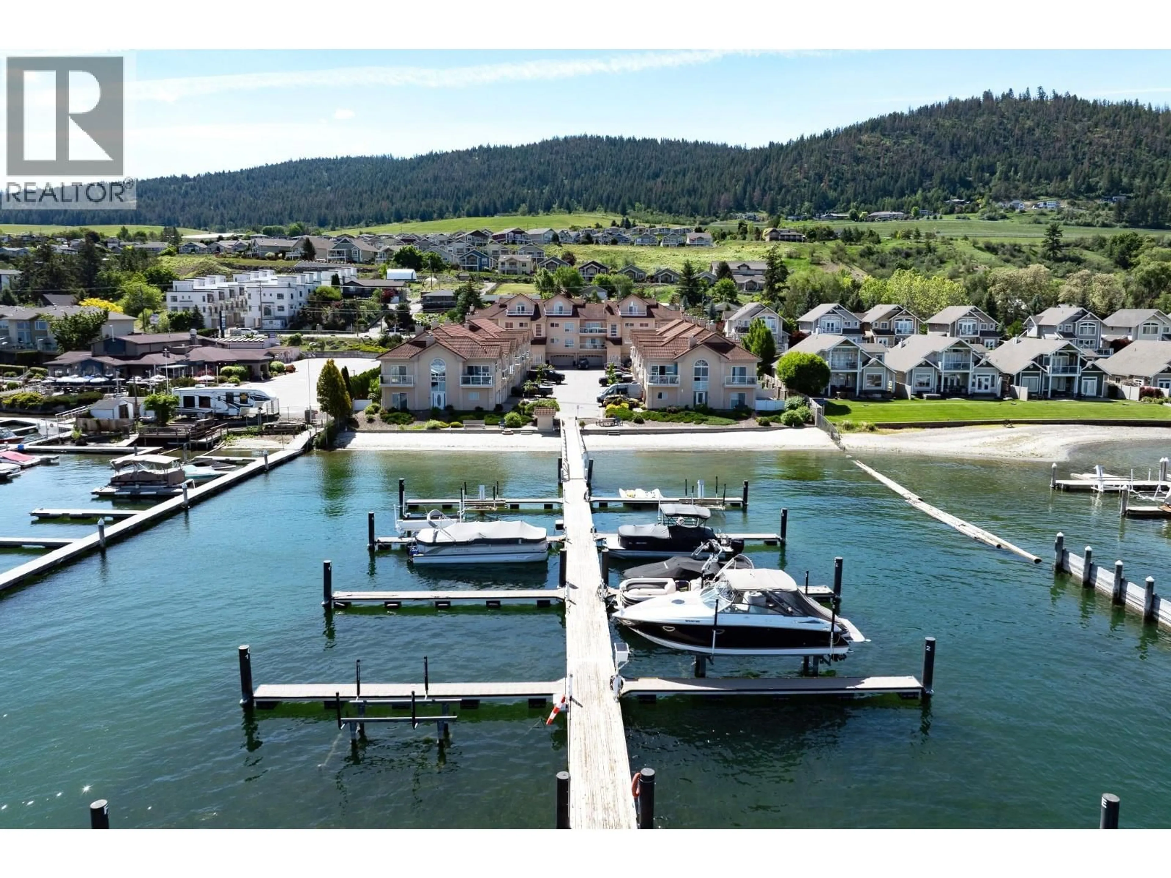 A pic from outside/outdoor area/front of a property/back of a property/a pic from drone, water/lake/river/ocean view for 18 - 7701 OKANAGAN LANDING ROAD, Vernon British Columbia V1H1L3
