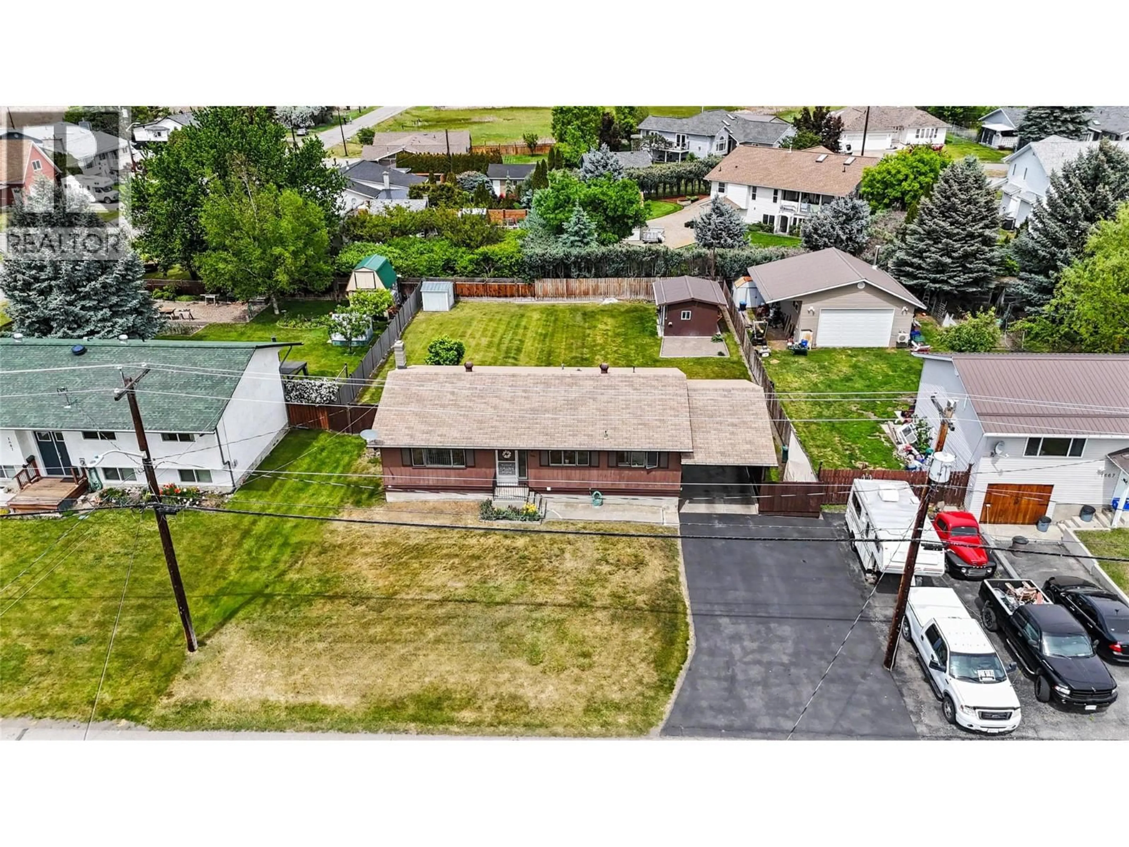 A pic from outside/outdoor area/front of a property/back of a property/a pic from drone, street for 1677 77TH AVENUE, Grand Forks British Columbia V0H1H0