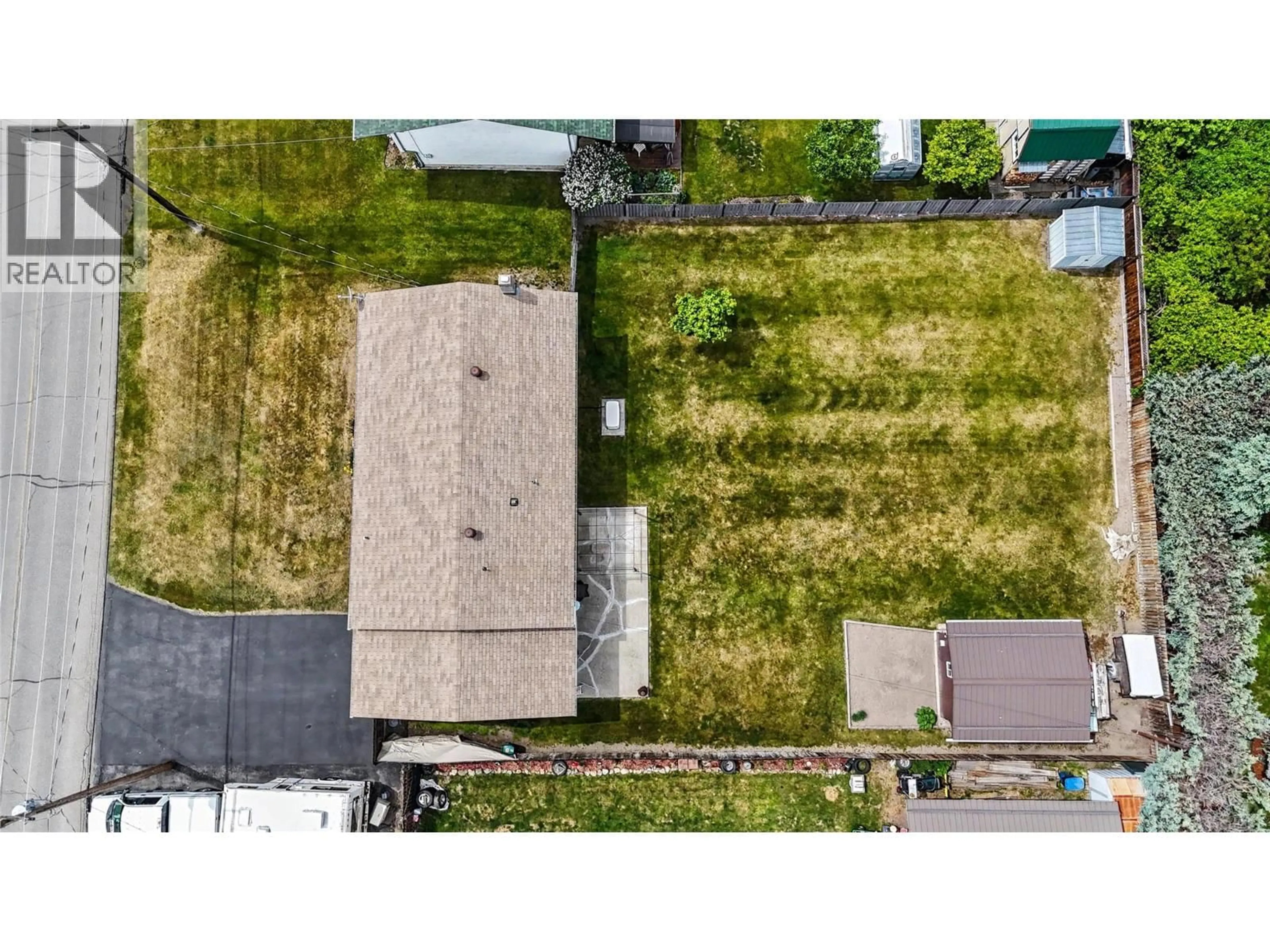 A pic from outside/outdoor area/front of a property/back of a property/a pic from drone, street for 1677 77TH AVENUE, Grand Forks British Columbia V0H1H0