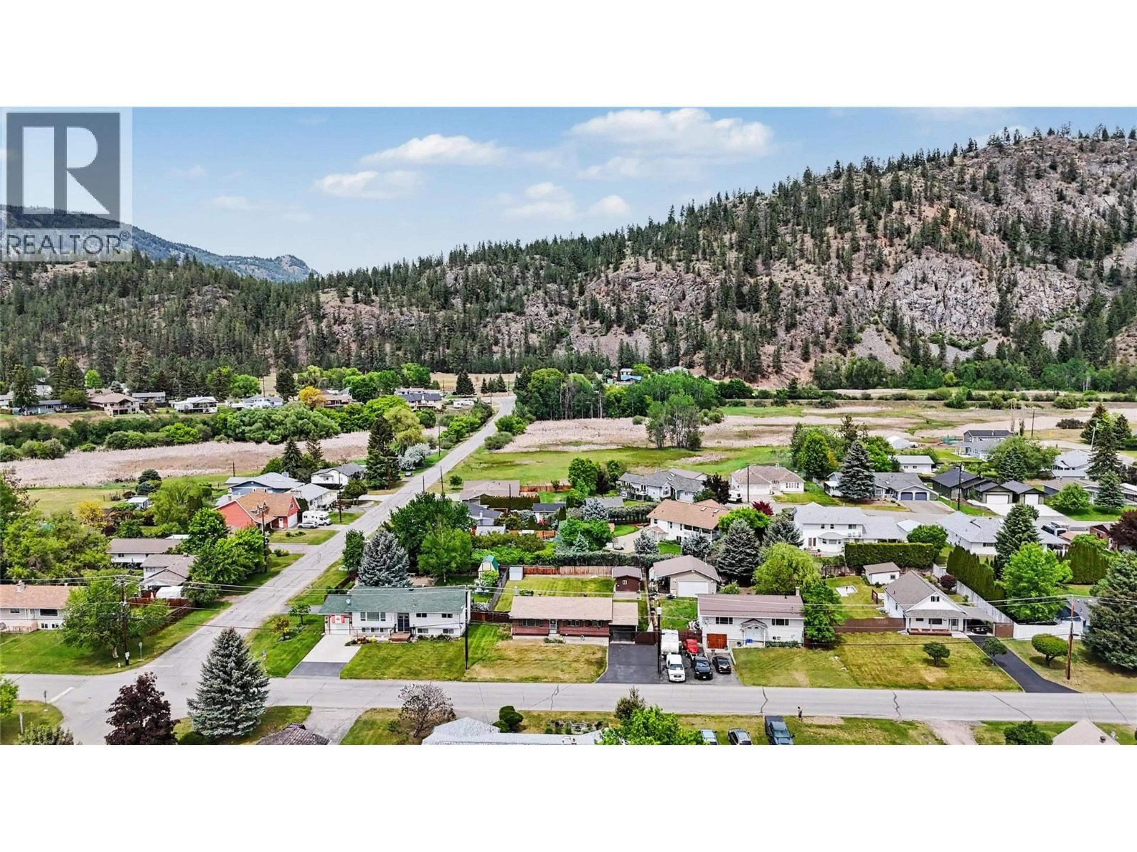 A pic from outside/outdoor area/front of a property/back of a property/a pic from drone, mountain view for 1677 77TH AVENUE, Grand Forks British Columbia V0H1H0