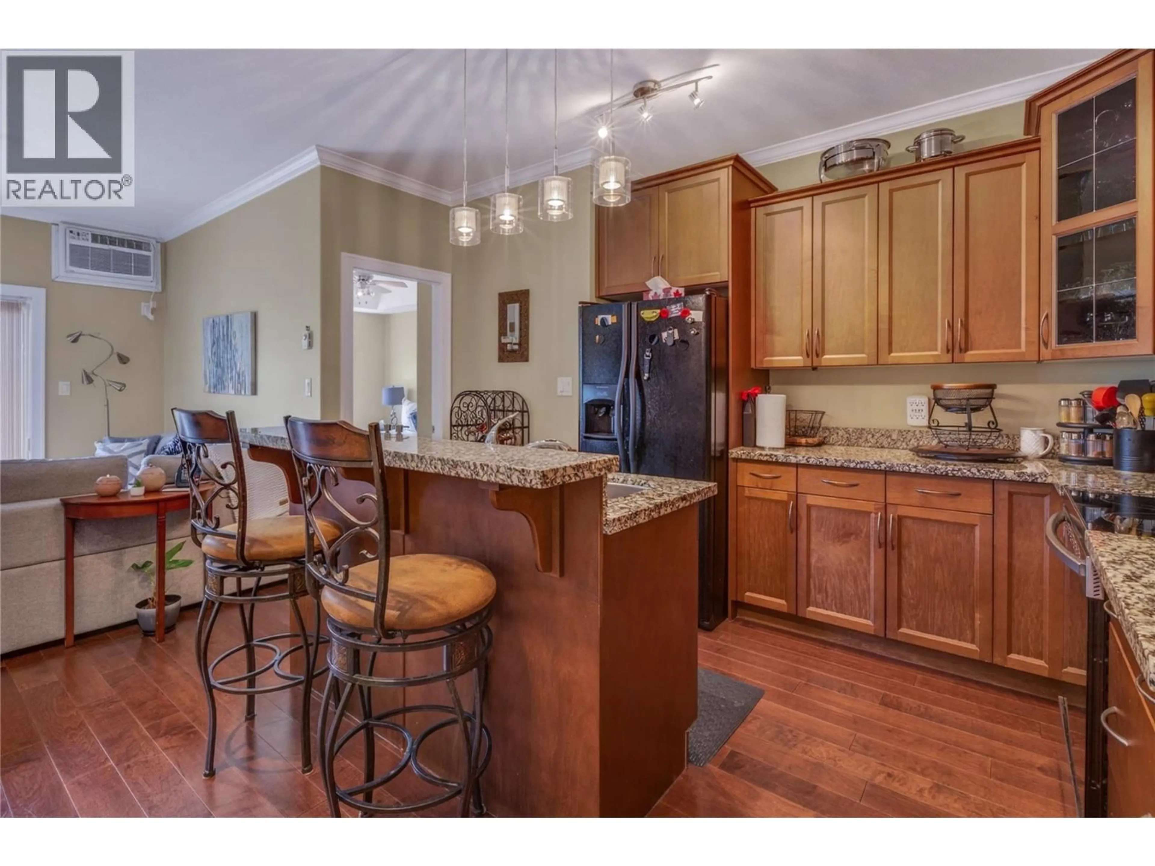 Open concept kitchen, wood/laminate floor for 305 - 240 WADE AVENUE W AVENUE, Penticton British Columbia V2A1T8