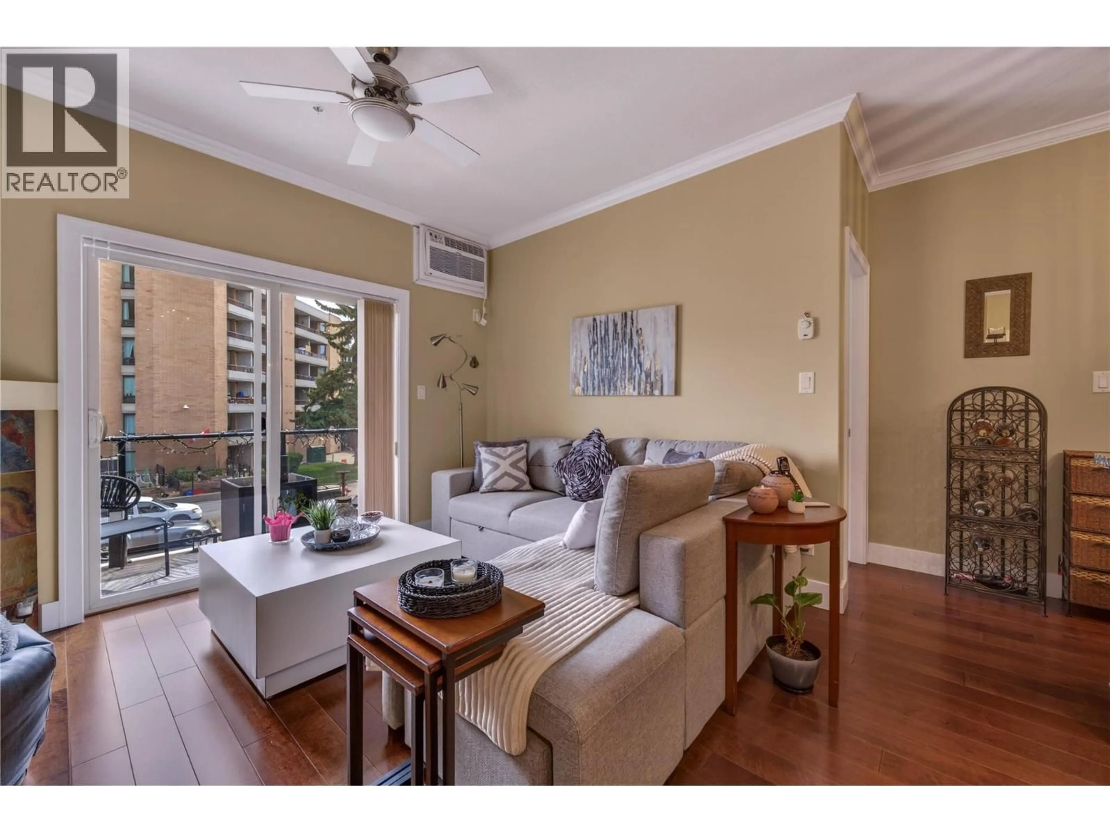 Living room with furniture, wood/laminate floor for 305 - 240 WADE AVENUE W AVENUE, Penticton British Columbia V2A1T8