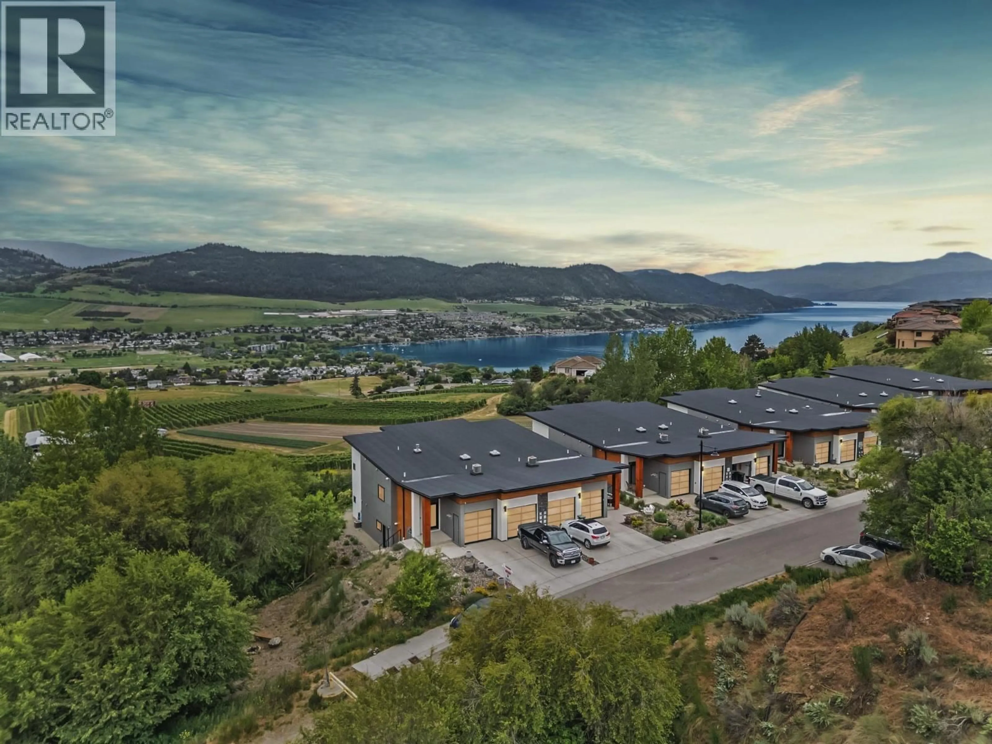 A pic from outside/outdoor area/front of a property/back of a property/a pic from drone, water/lake/river/ocean view for 206 VINEYARD WAY, Vernon British Columbia V1H1Z7