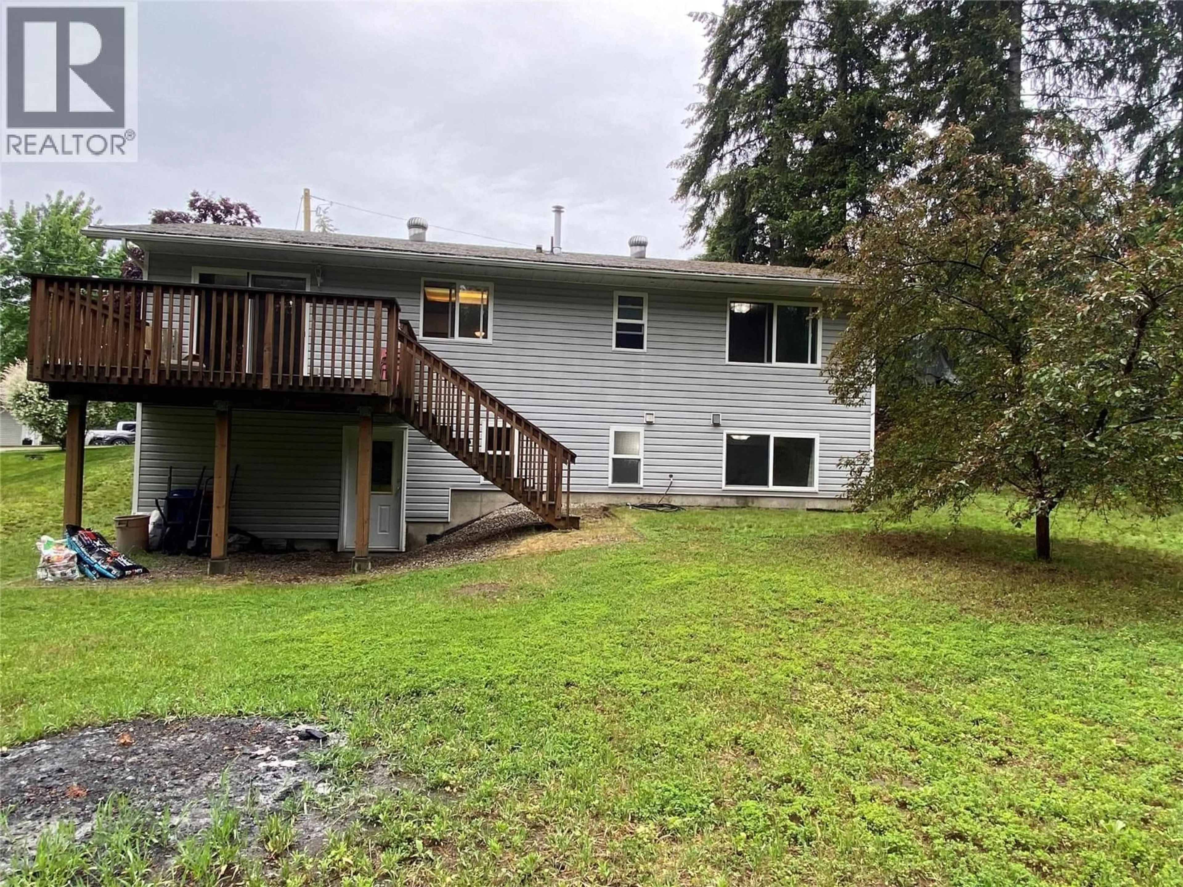 A pic from outside/outdoor area/front of a property/back of a property/a pic from drone, unknown for 945 PINE CRESCENT, Genelle British Columbia V0G1G0