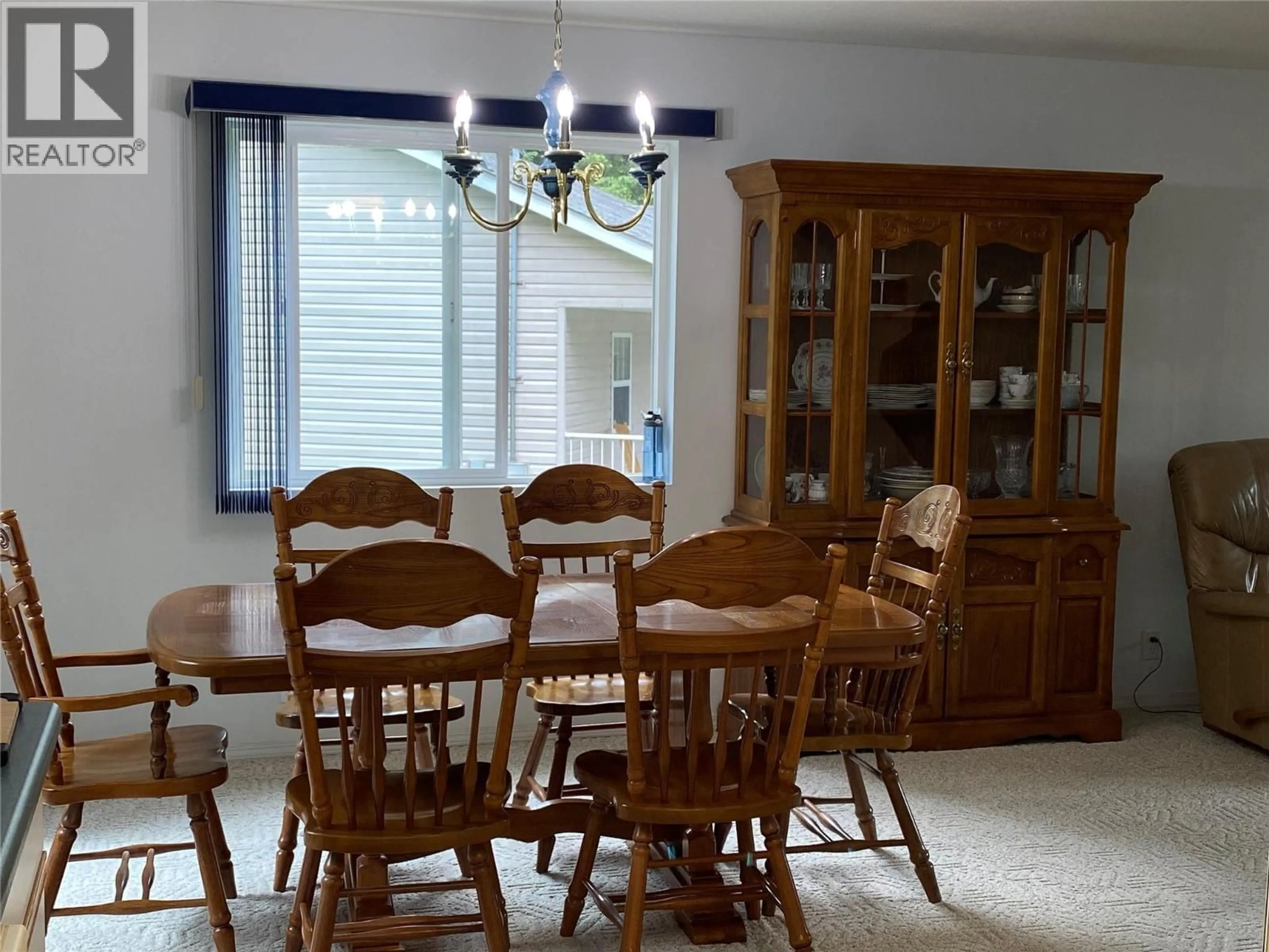 Dining room, wood/laminate floor for 945 PINE CRESCENT, Genelle British Columbia V0G1G0