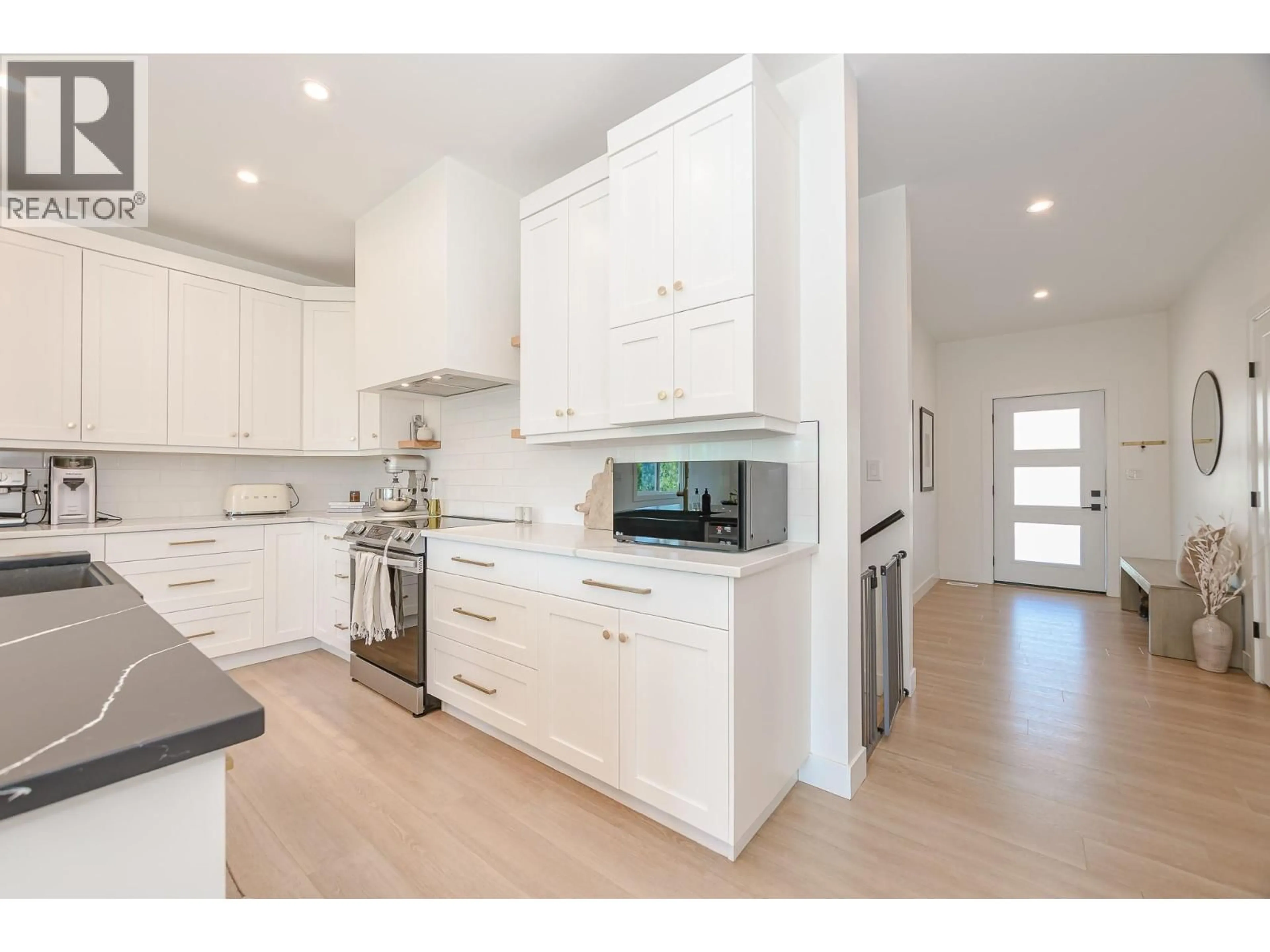 Open concept kitchen, wood/laminate floor for 952 RIDGEWOOD DRIVE, Enderby British Columbia V0E1V1