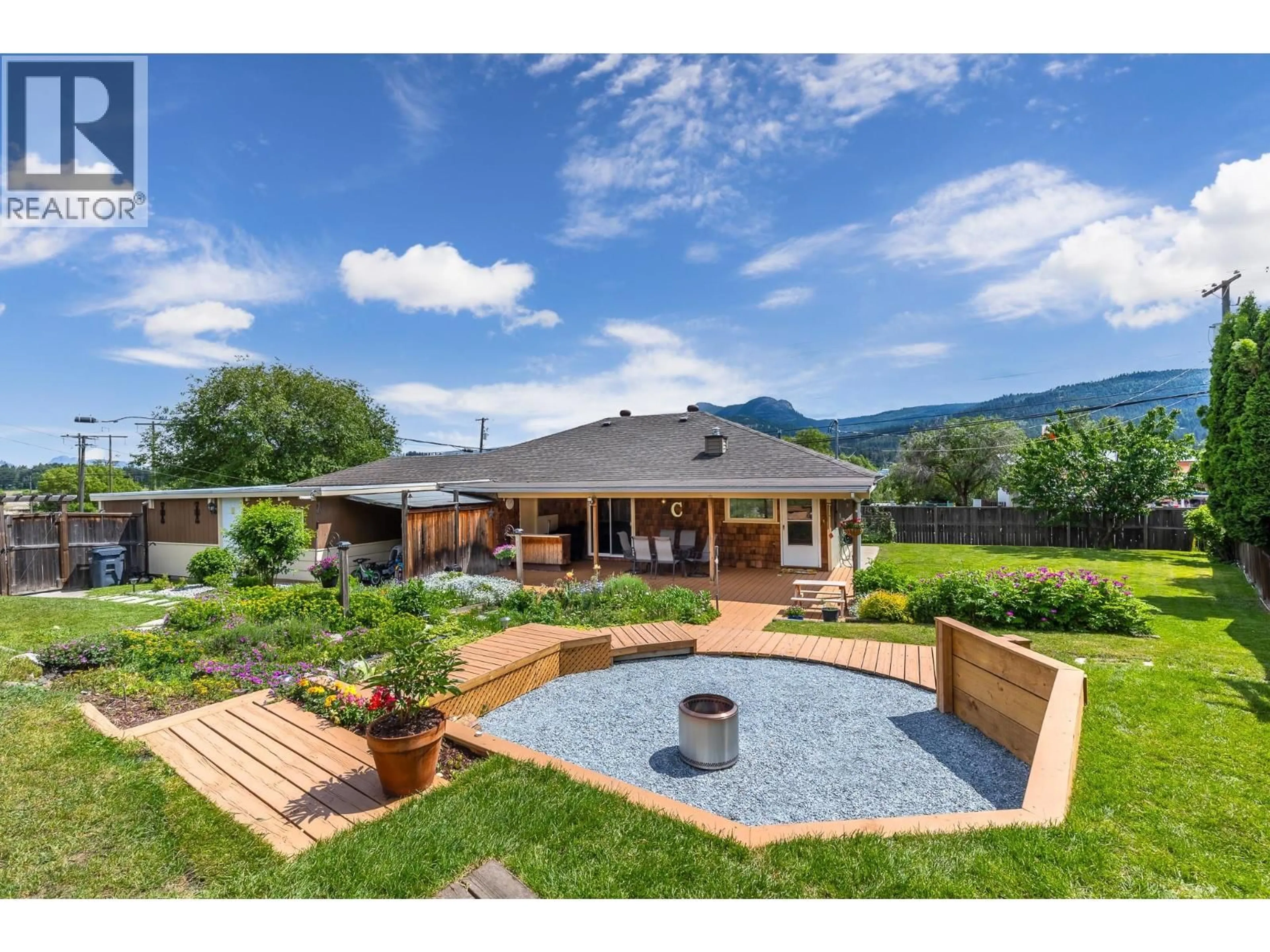 A pic from outside/outdoor area/front of a property/back of a property/a pic from drone, mountain view for 6310 FREEMAN DRIVE, Coldstream British Columbia V1B3C7