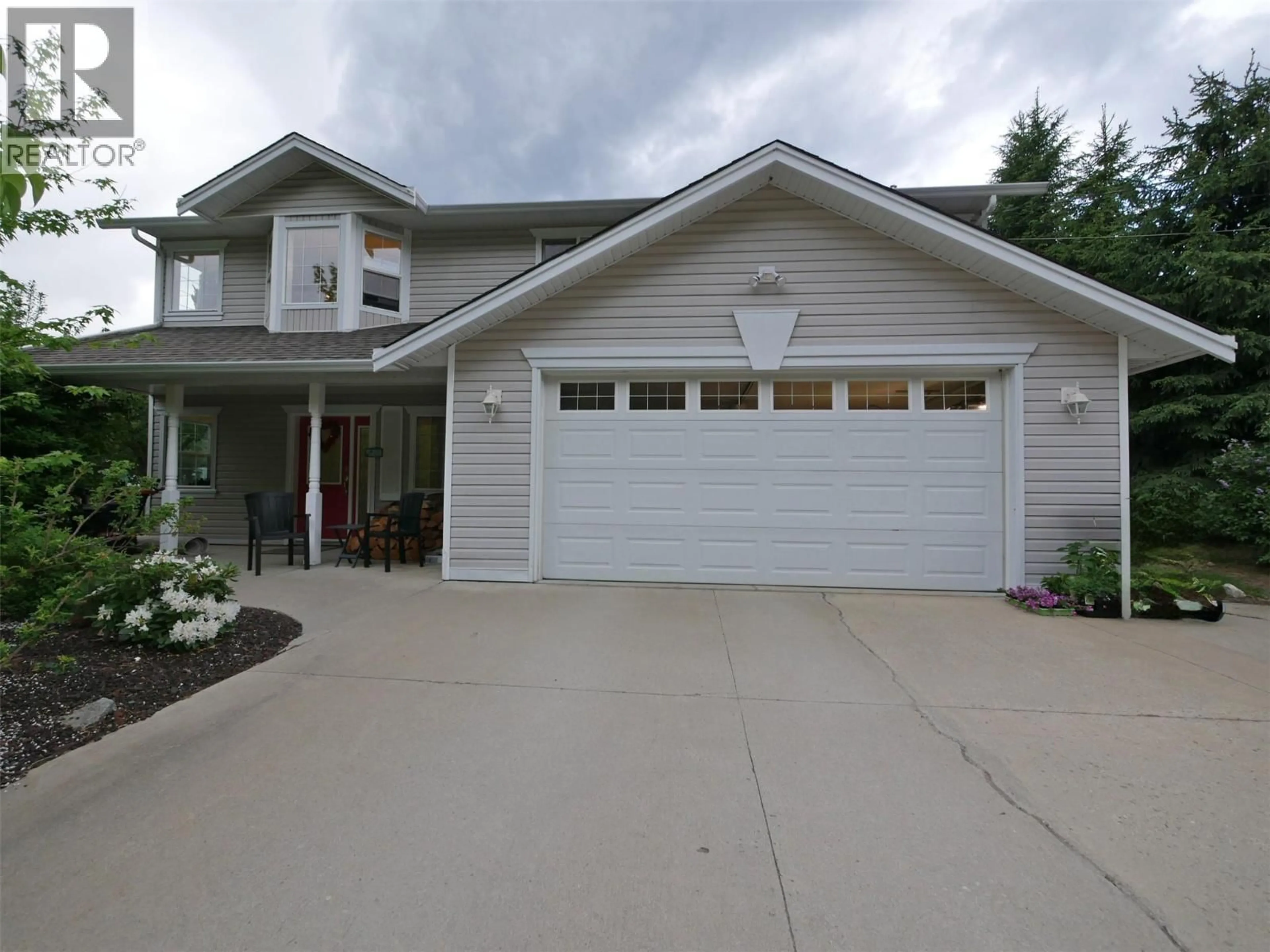 Home with vinyl exterior material, street for 1958 PASS CREEK ROAD, Castlegar British Columbia V1N4S8