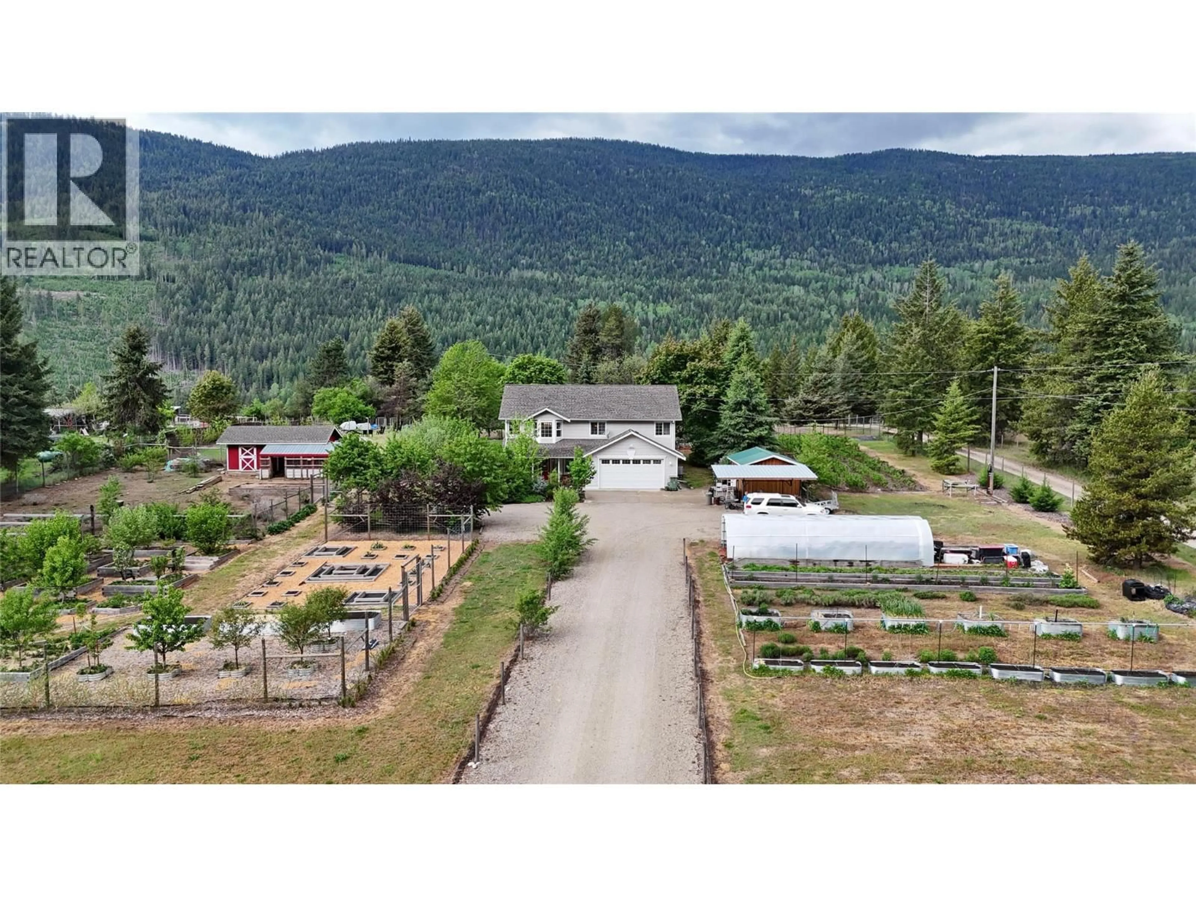 A pic from outside/outdoor area/front of a property/back of a property/a pic from drone, mountain view for 1958 PASS CREEK ROAD, Castlegar British Columbia V1N4S8