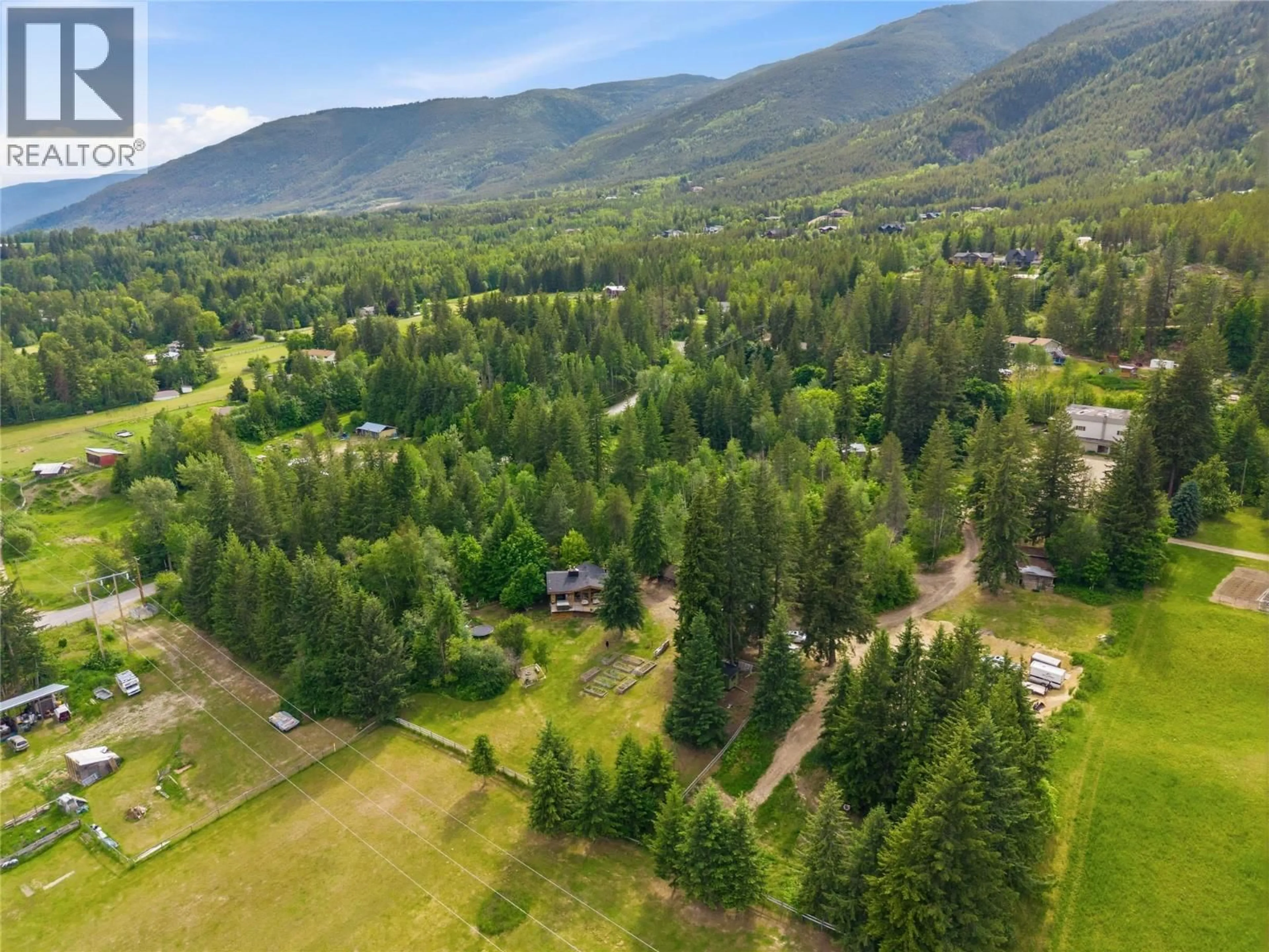 A pic from outside/outdoor area/front of a property/back of a property/a pic from drone, mountain view for 5150 49 STREET NORTHWEST, Salmon Arm British Columbia V1E3A6