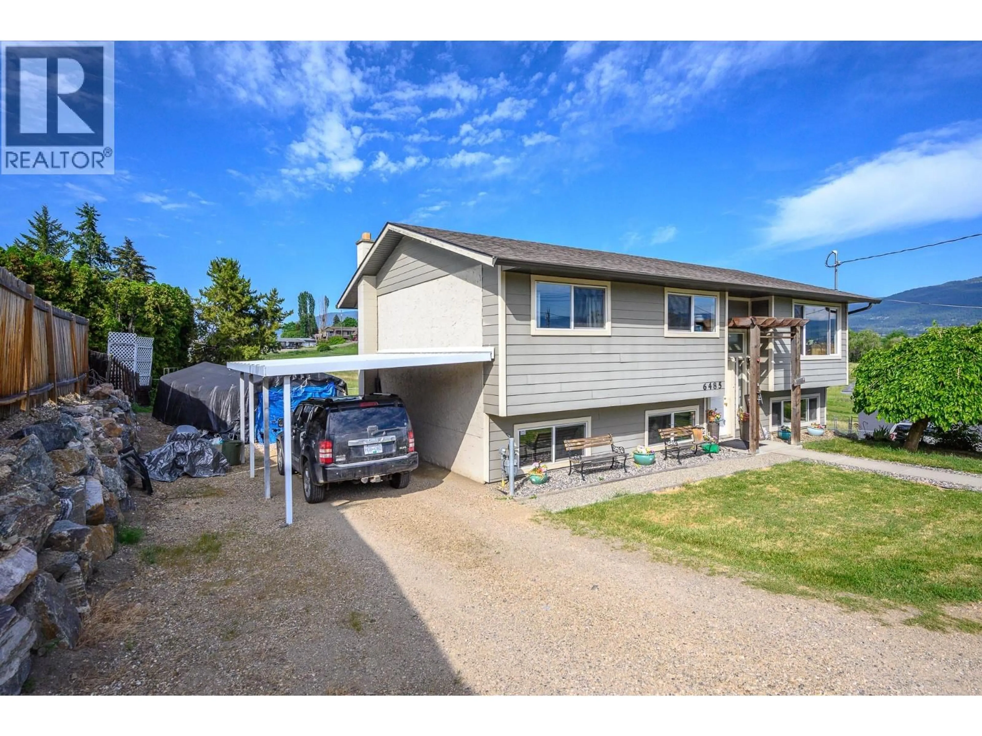 A pic from outside/outdoor area/front of a property/back of a property/a pic from drone, street for 6485 CARDINAL ROAD, Vernon British Columbia V1H1W3