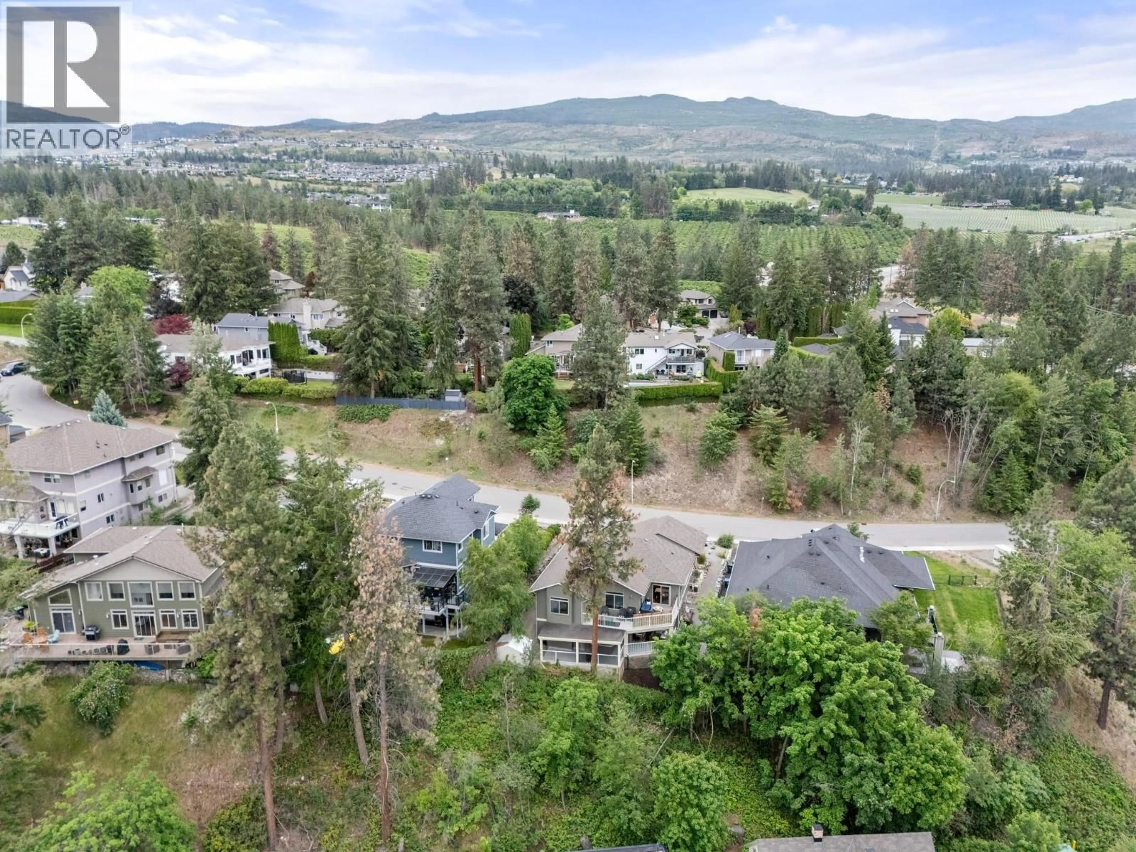 A pic from outside/outdoor area/front of a property/back of a property/a pic from drone, mountain view for 594 VINTAGE TERRACE ROAD, Kelowna British Columbia V1W3B3
