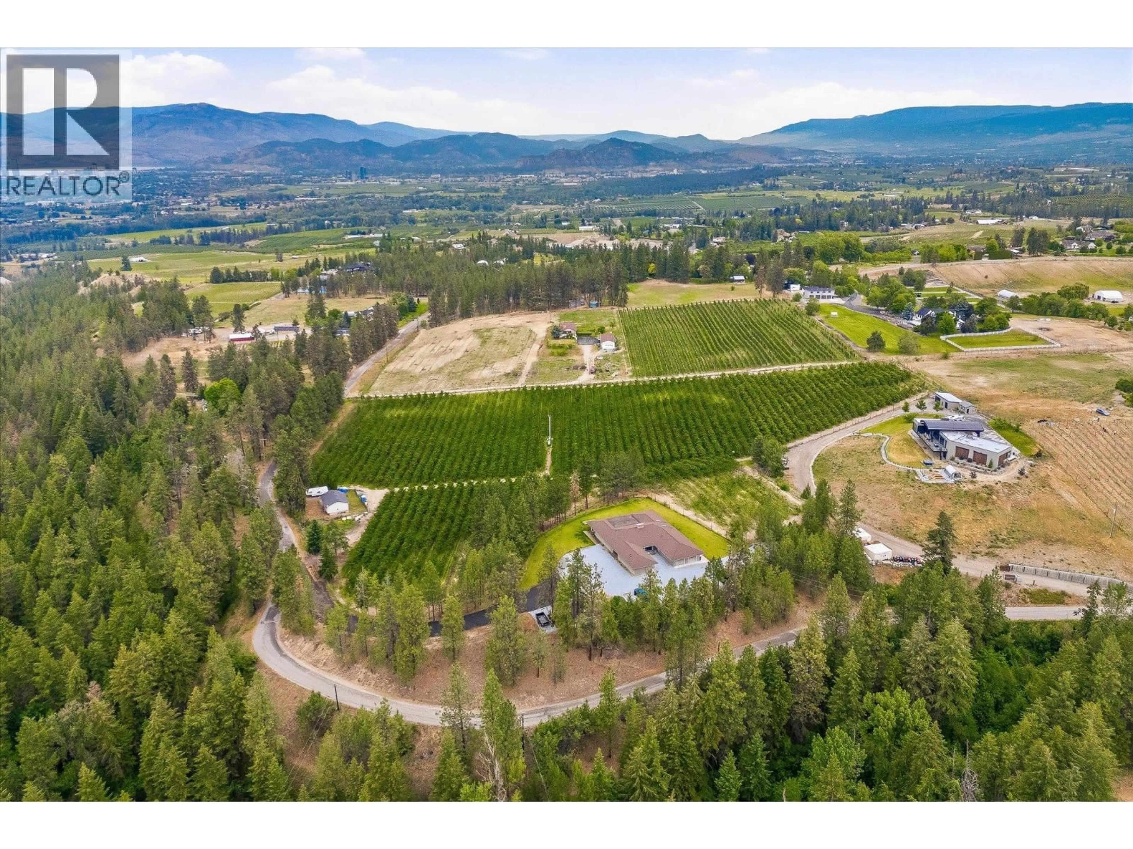 A pic from outside/outdoor area/front of a property/back of a property/a pic from drone, mountain view for 4235 TODD ROAD, Kelowna British Columbia V1W4B8